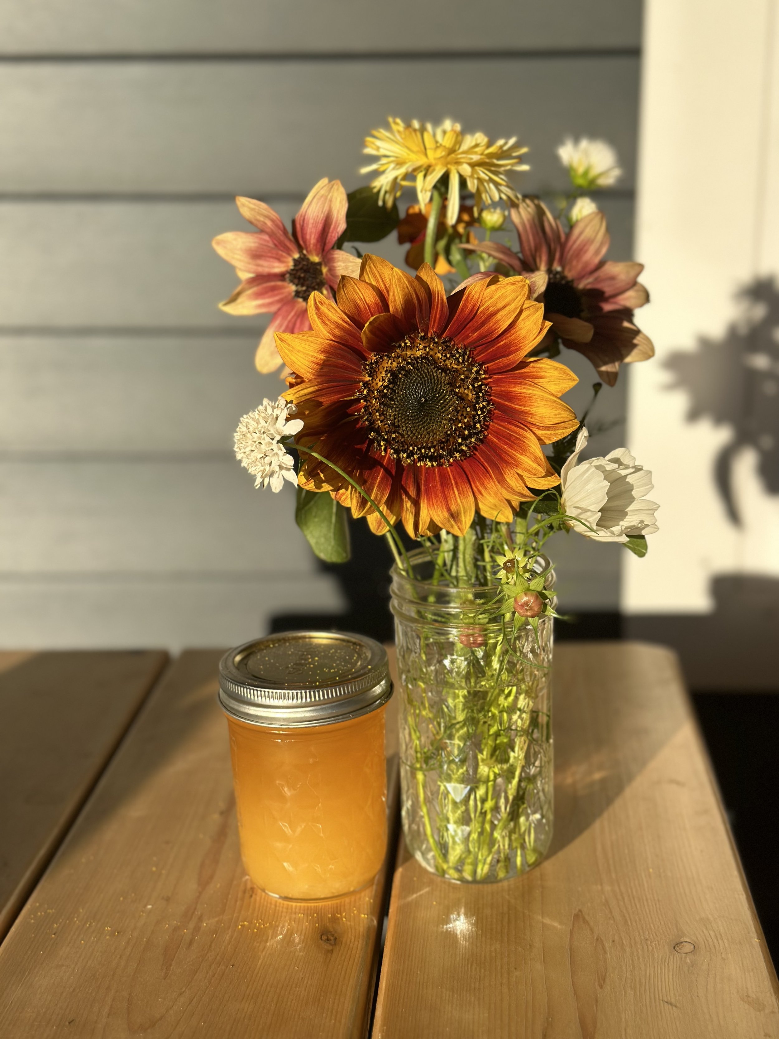 On the right pictured is a small mason jar arrangement