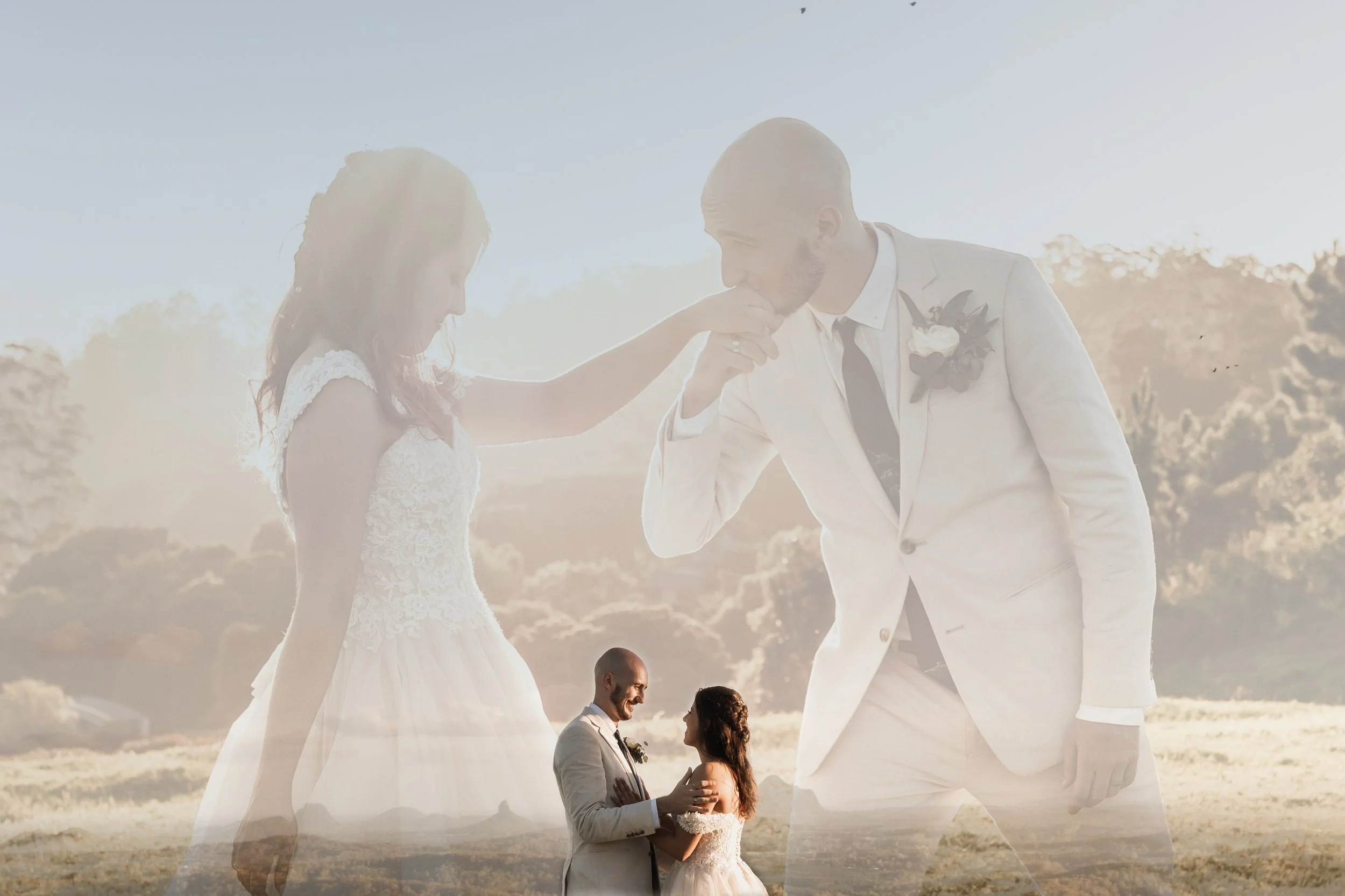 A wedding scene with a groom kissing a bride's hand, a couple dancing in the background, and a scenic outdoor landscape with trees and a bright sky.
