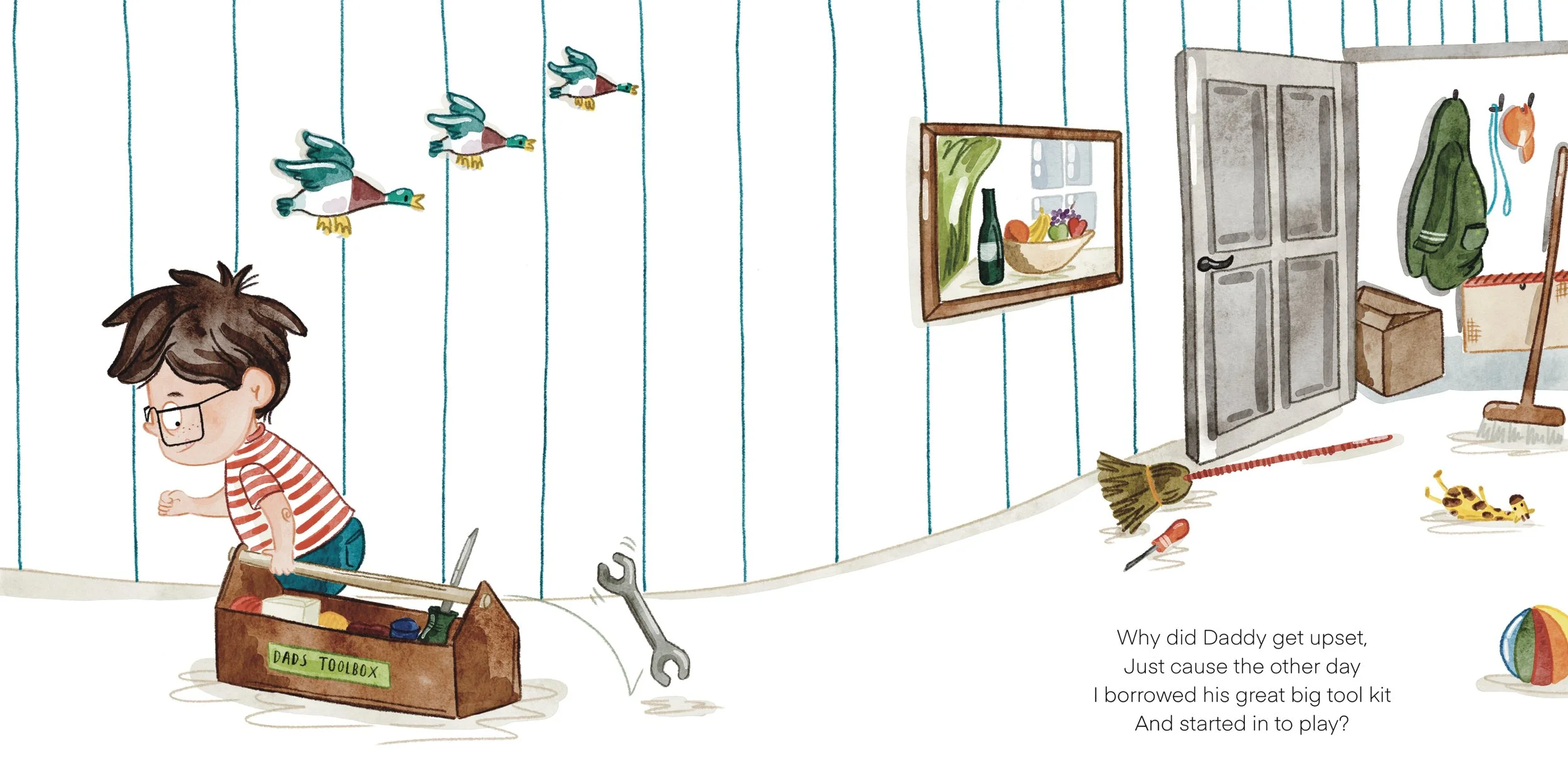 A boy with glasses in a striped shirt is standing in a room filled with toys and tools. The room has a blue-paneled wall, a framed picture of a bottle and fruit, and various toys including ducks, a toy giraffe, a ball, and a broom. The boy is holding a large tool from a toolbox labeled 'Dad's Toolbox'.