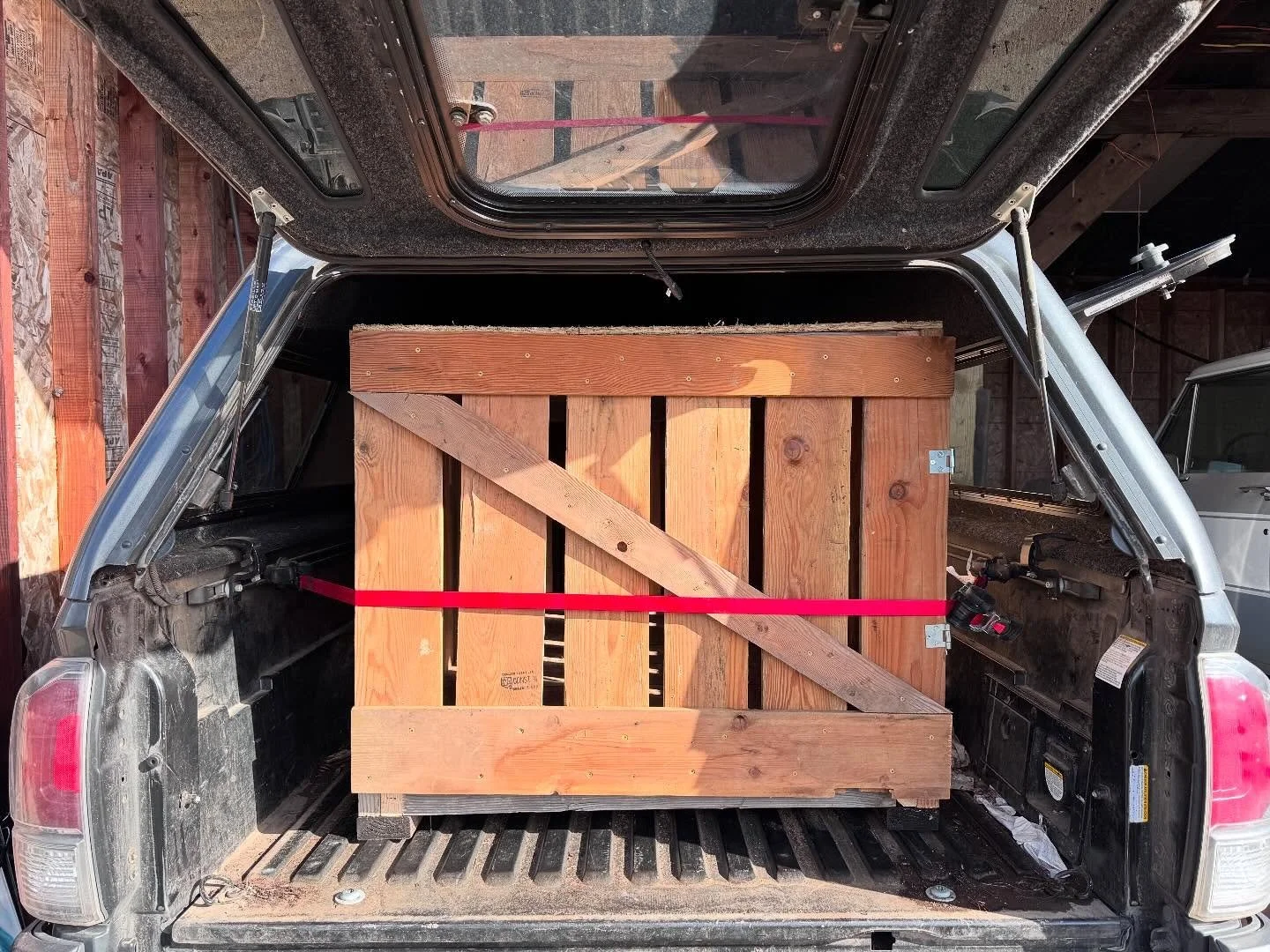 On the road again 

Nick put the finishing touches on our new travel crate yesterday and squeeeezed it into the Tacoma.

We&rsquo;ll be hitting the road soon and back late this afternoon with the final 3 piglets (5 mo) to round out our herd this year