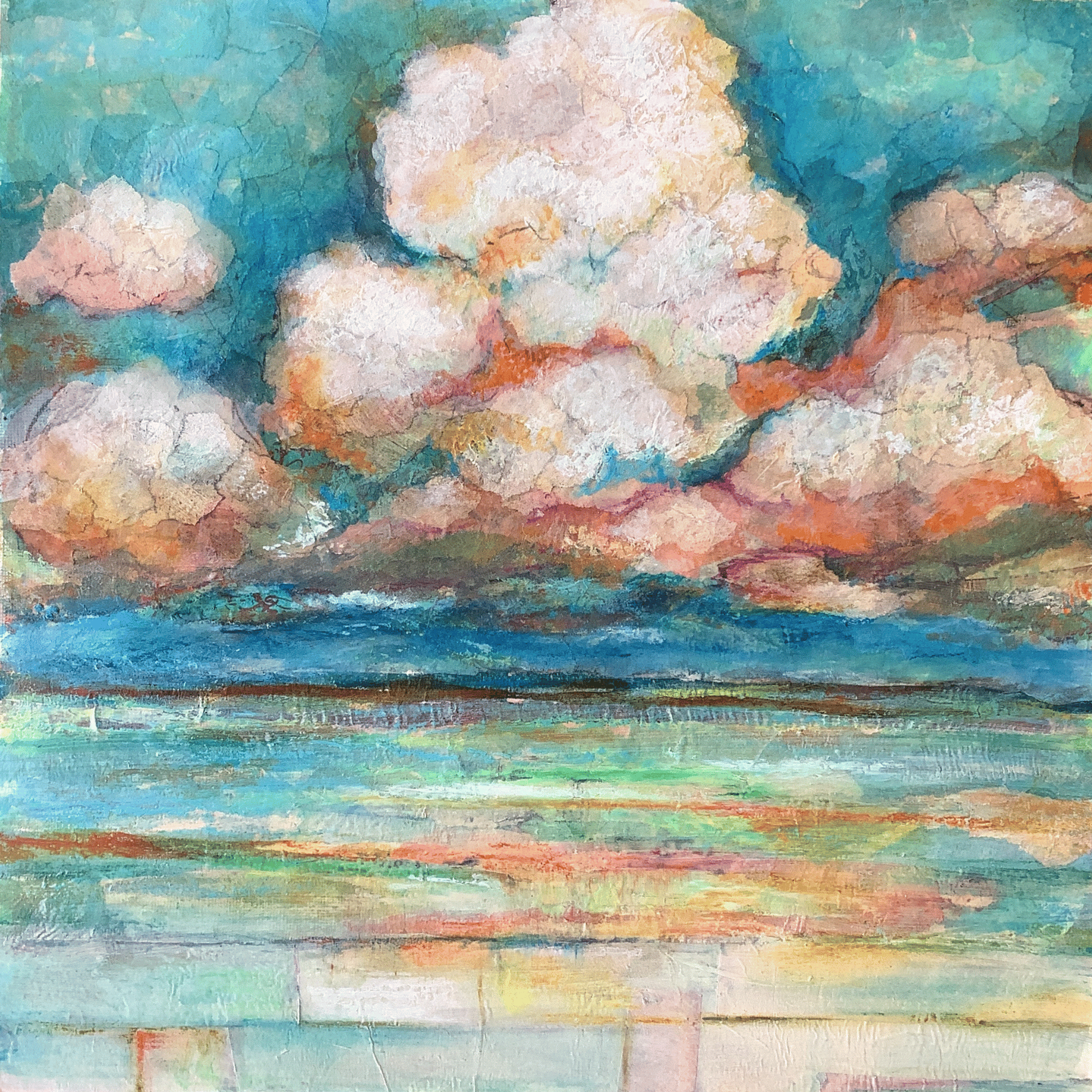 puffy clouds over water orange blue pink