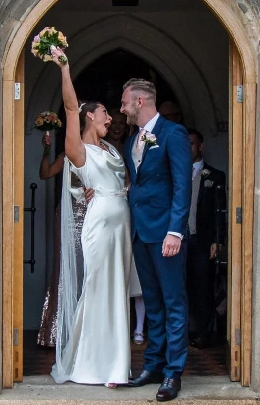 Paige and her husband on their wedding day.