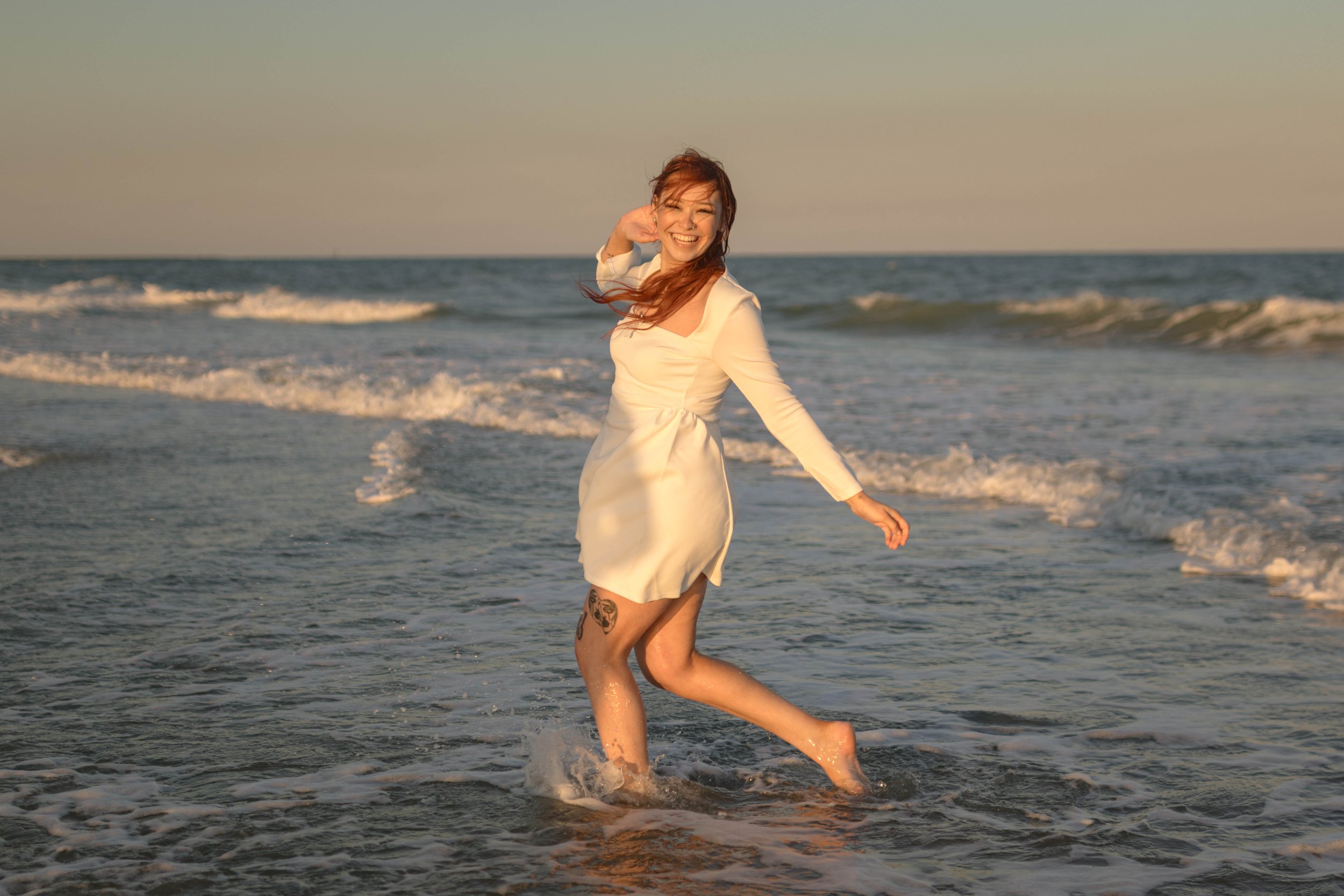 Creative couples portrait in dreamy golden light on Myrtle Beach shoreline