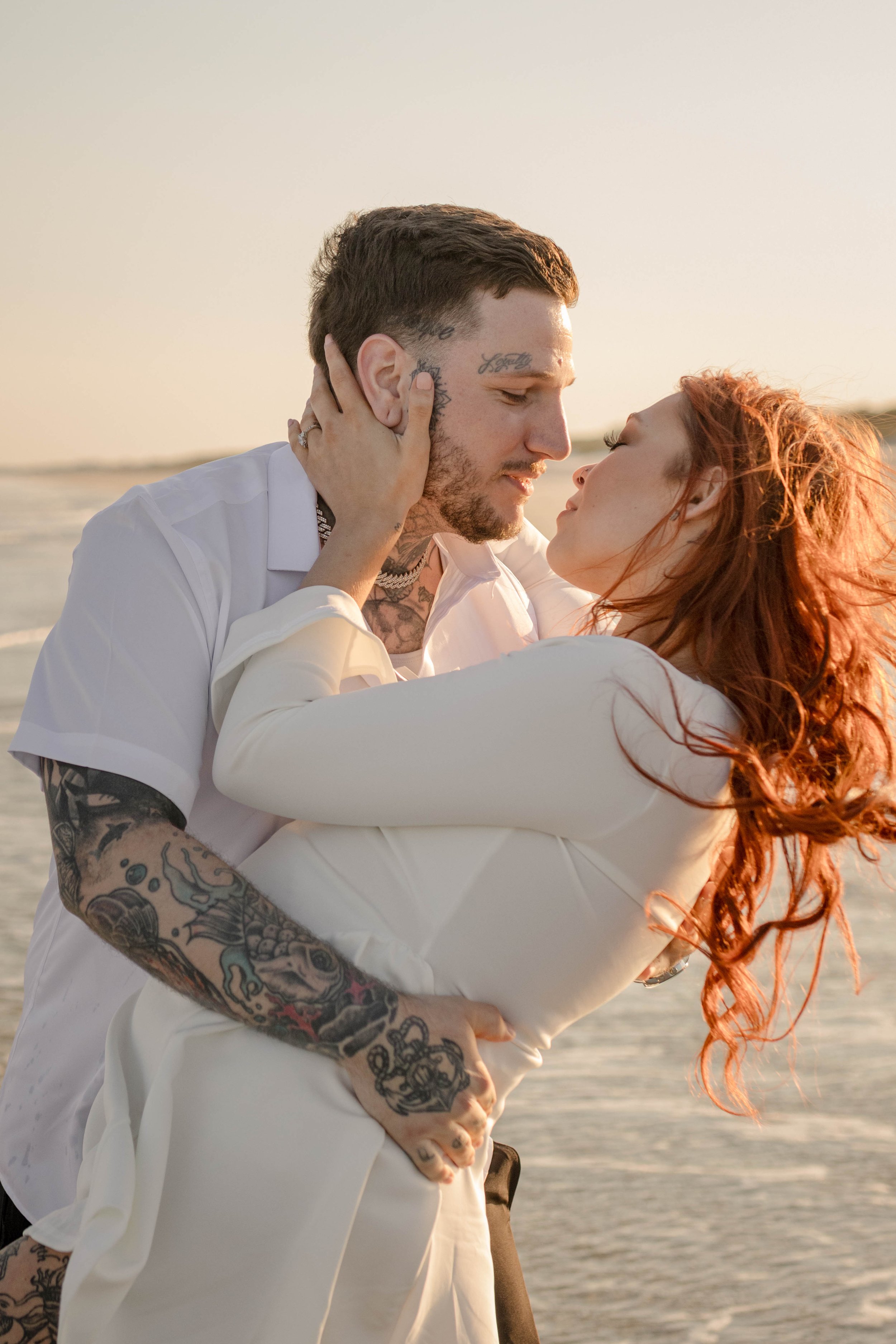 Creative couples portrait in dreamy golden light on Myrtle Beach shoreline