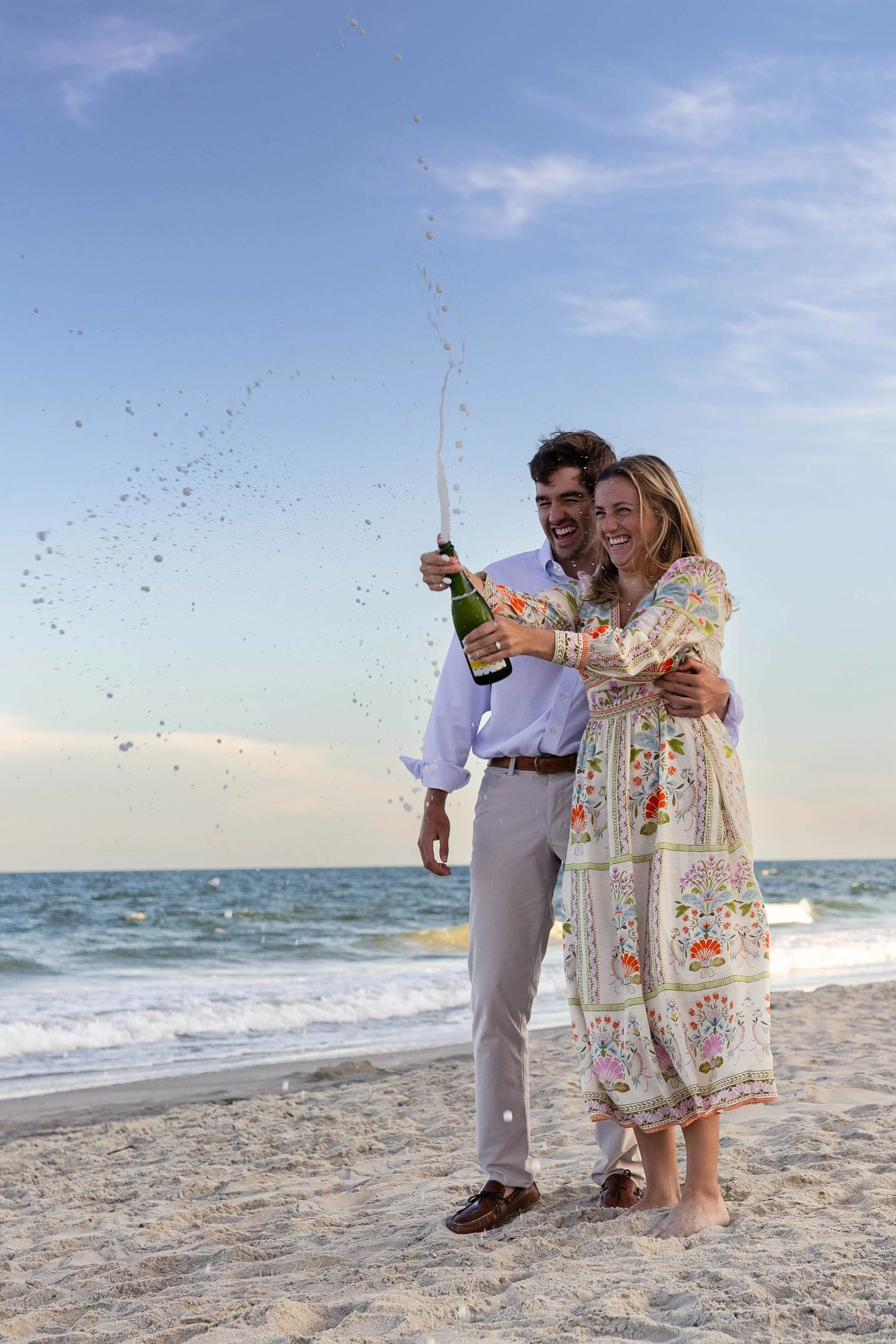 Pawleys Island proposal photography featuring a romantic beach engagement, champagne celebration