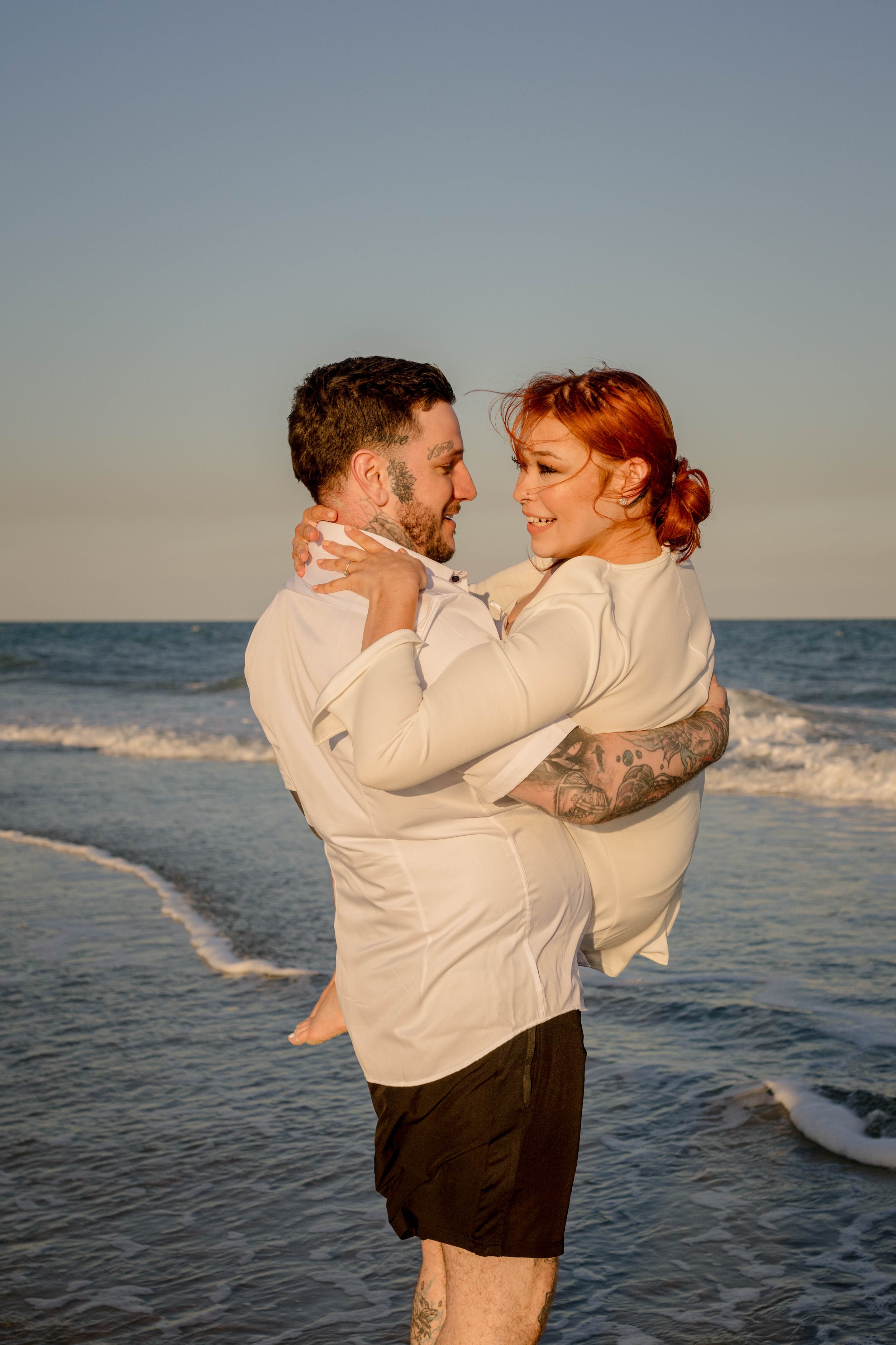 Creative couples portrait in dreamy golden light on Myrtle Beach shoreline