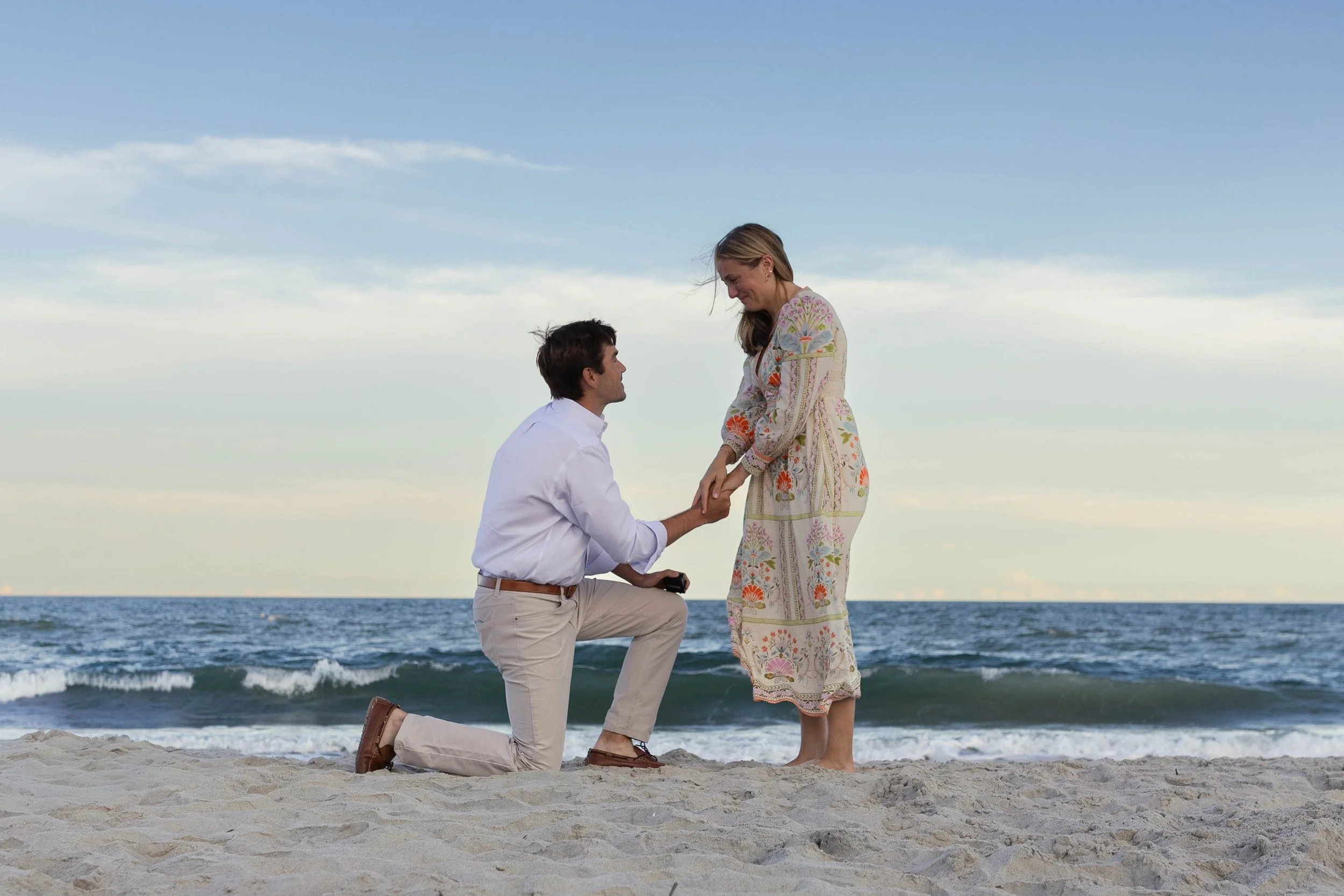 Pawleys Island proposal photography featuring a romantic beach engagement, champagne celebration