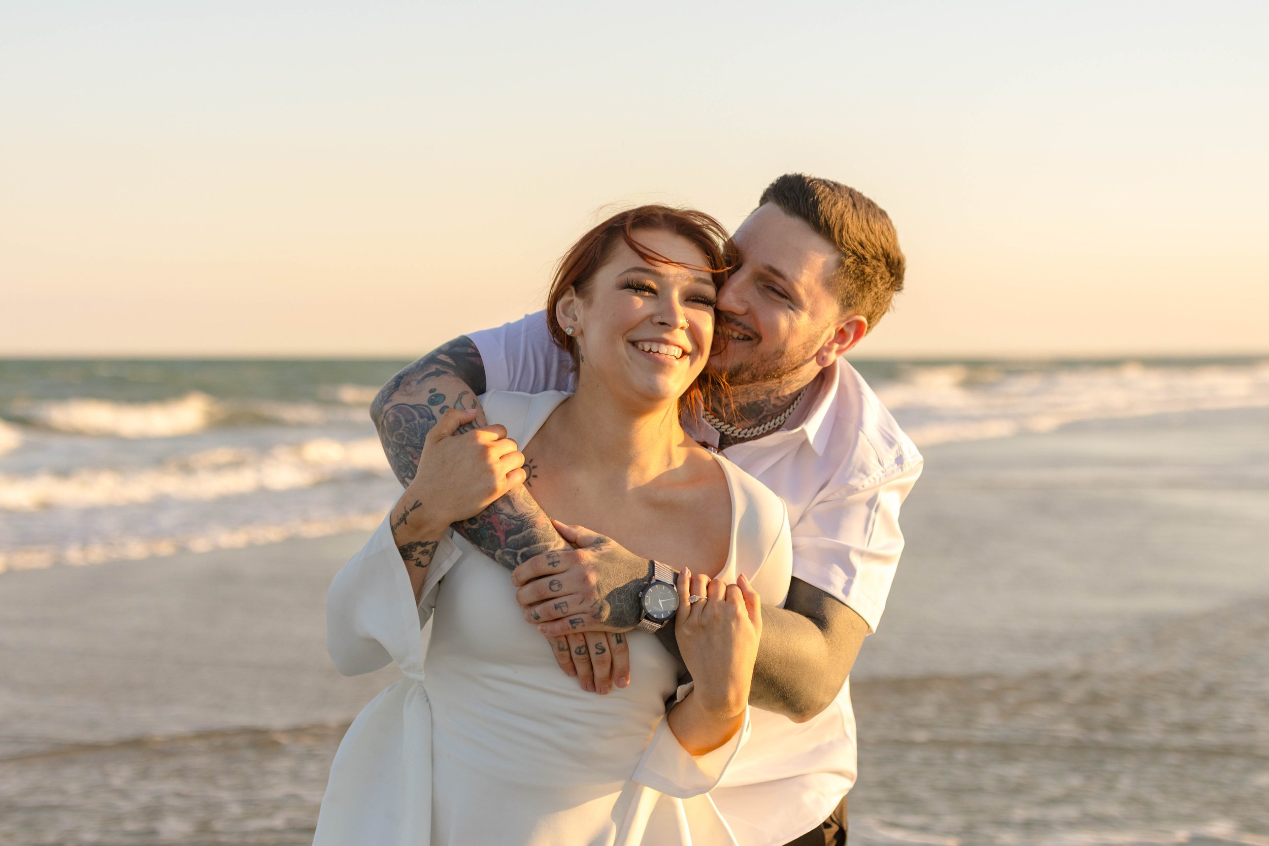 Creative couples portrait in dreamy golden light on Myrtle Beach shoreline