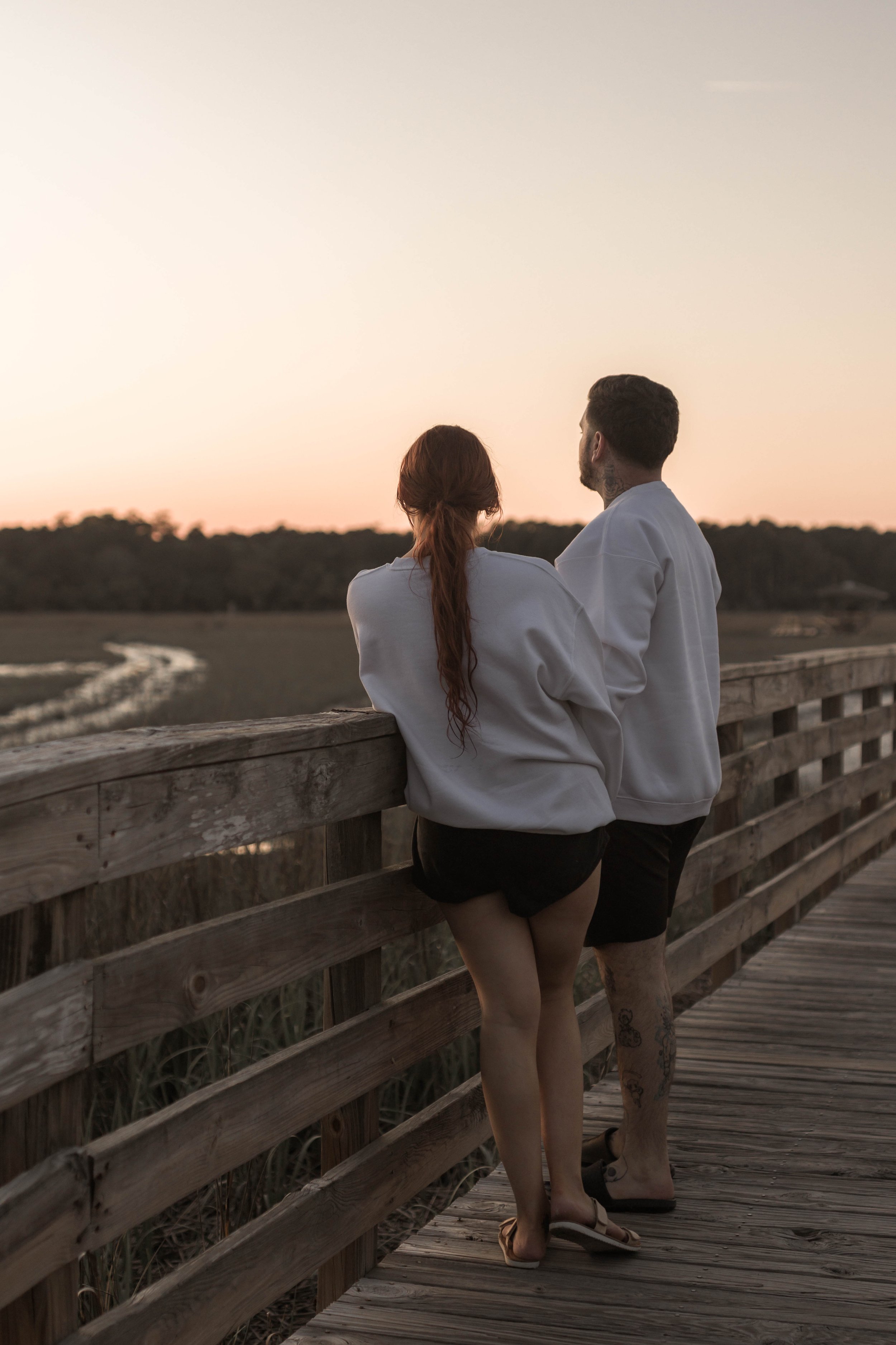 Creative couples portrait in dreamy golden light on Myrtle Beach shoreline