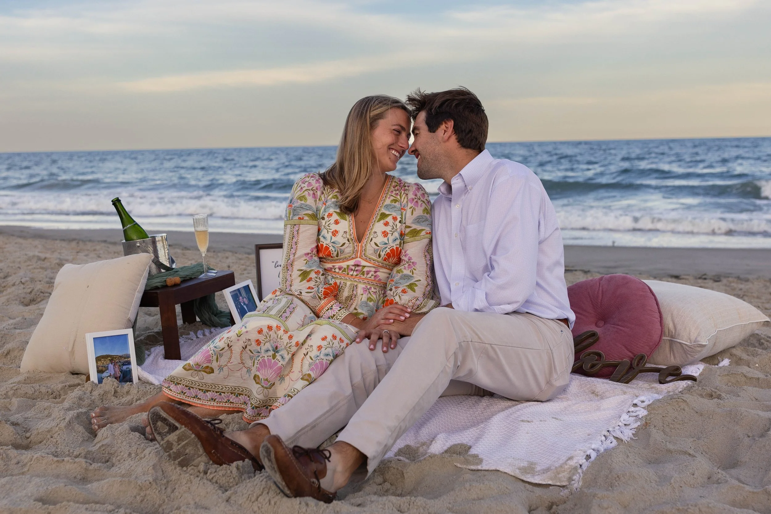 Pawleys Island proposal photography featuring a romantic beach engagement, champagne celebration