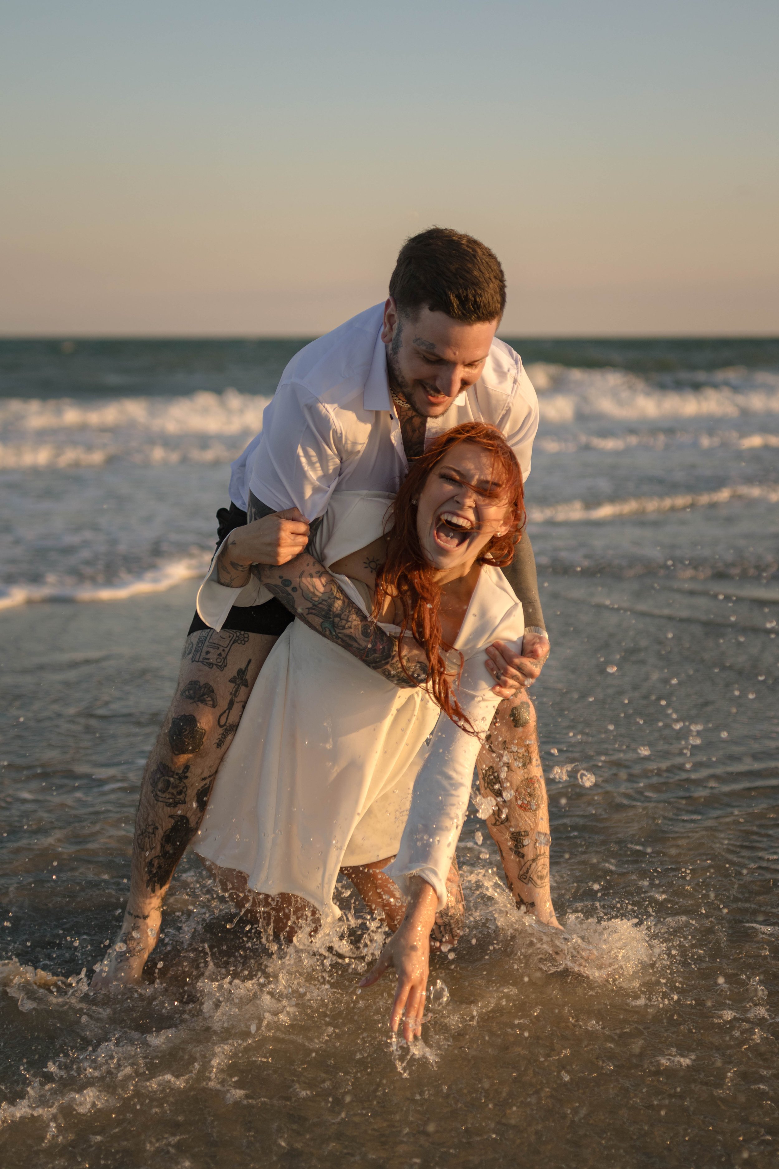 Creative couples portrait in dreamy golden light on Myrtle Beach shoreline
