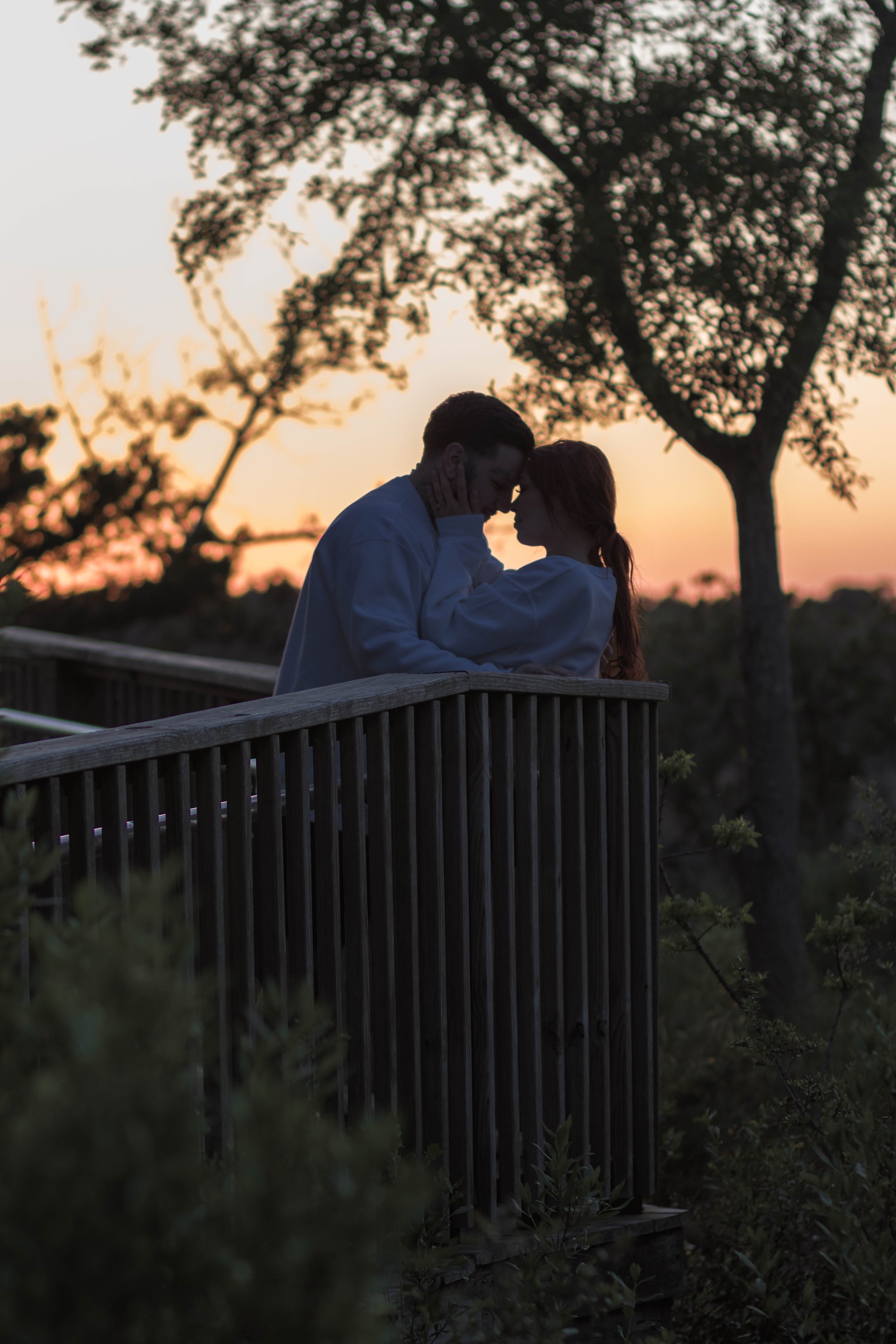Creative couples portrait in dreamy golden light on Myrtle Beach shoreline