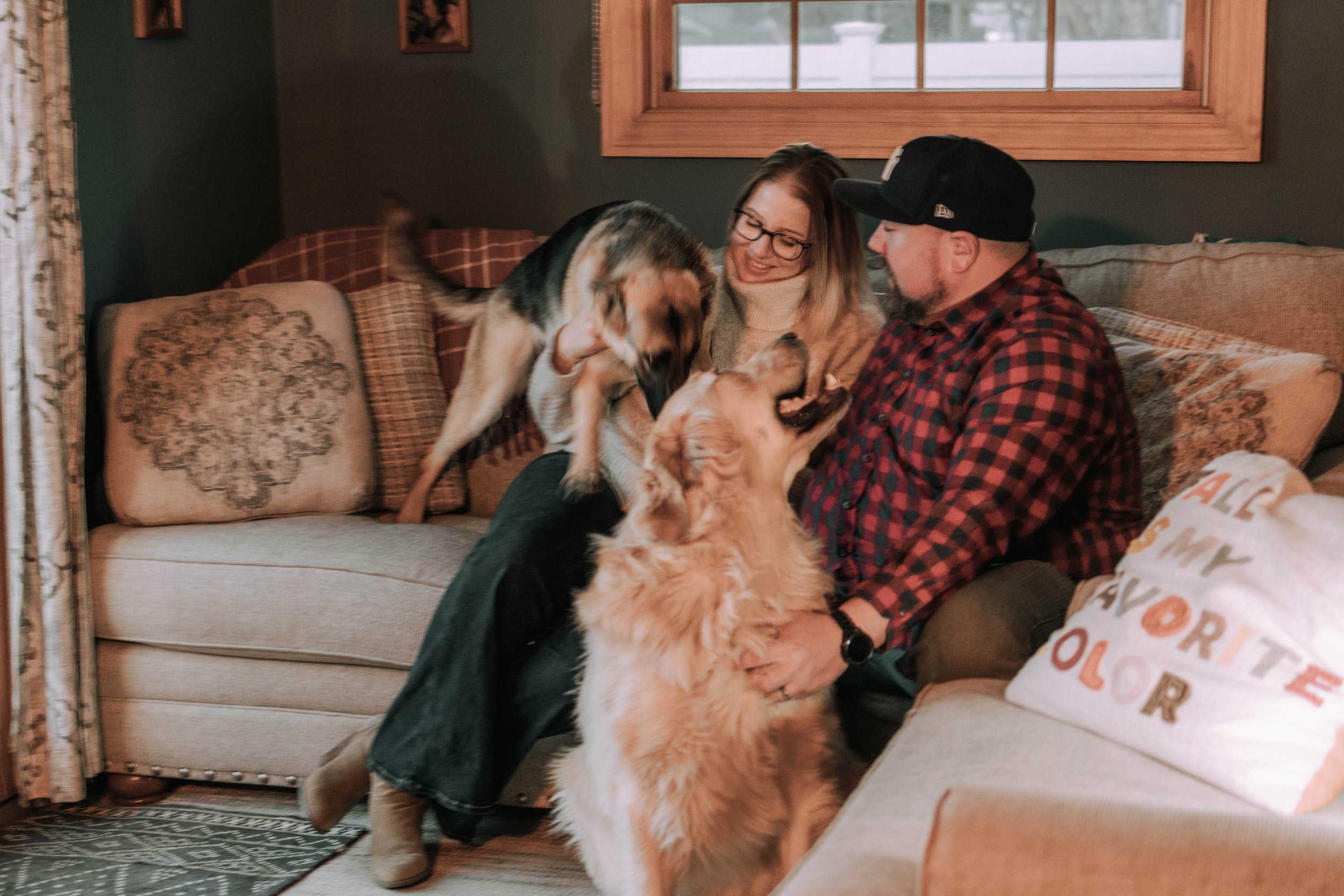 In-Home lifestyle couple photography with German shepherd and golden retriever