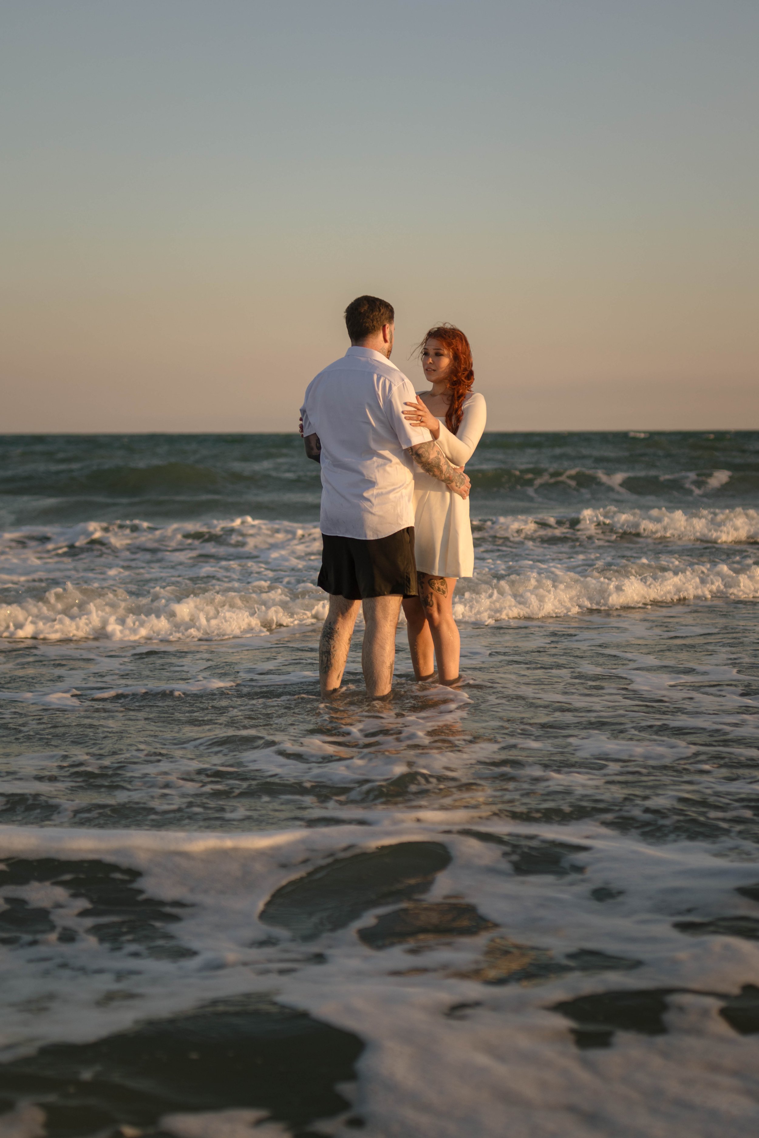 Creative couples portrait in dreamy golden light on Myrtle Beach shoreline