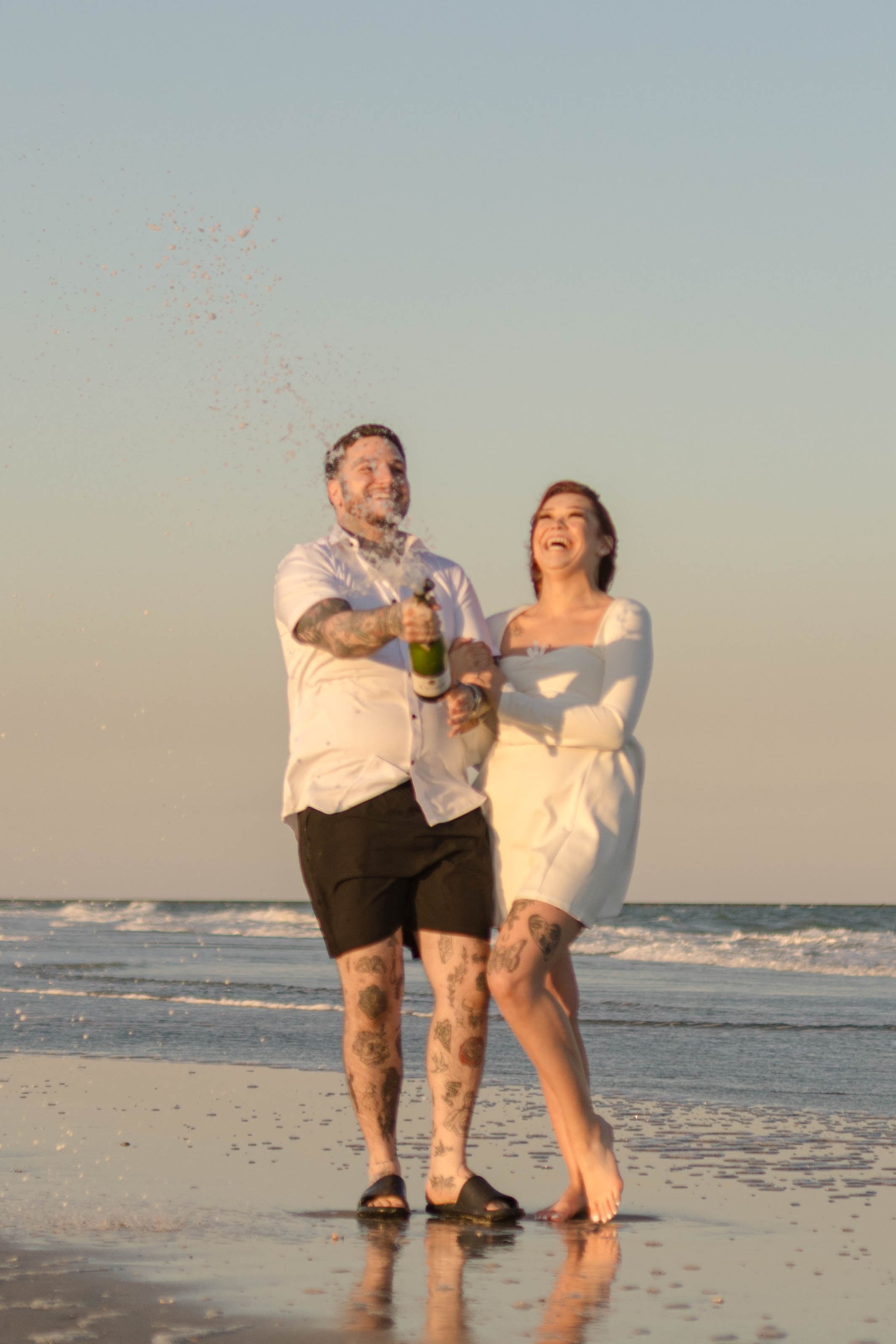 Creative couples portrait in dreamy golden light on Myrtle Beach shoreline