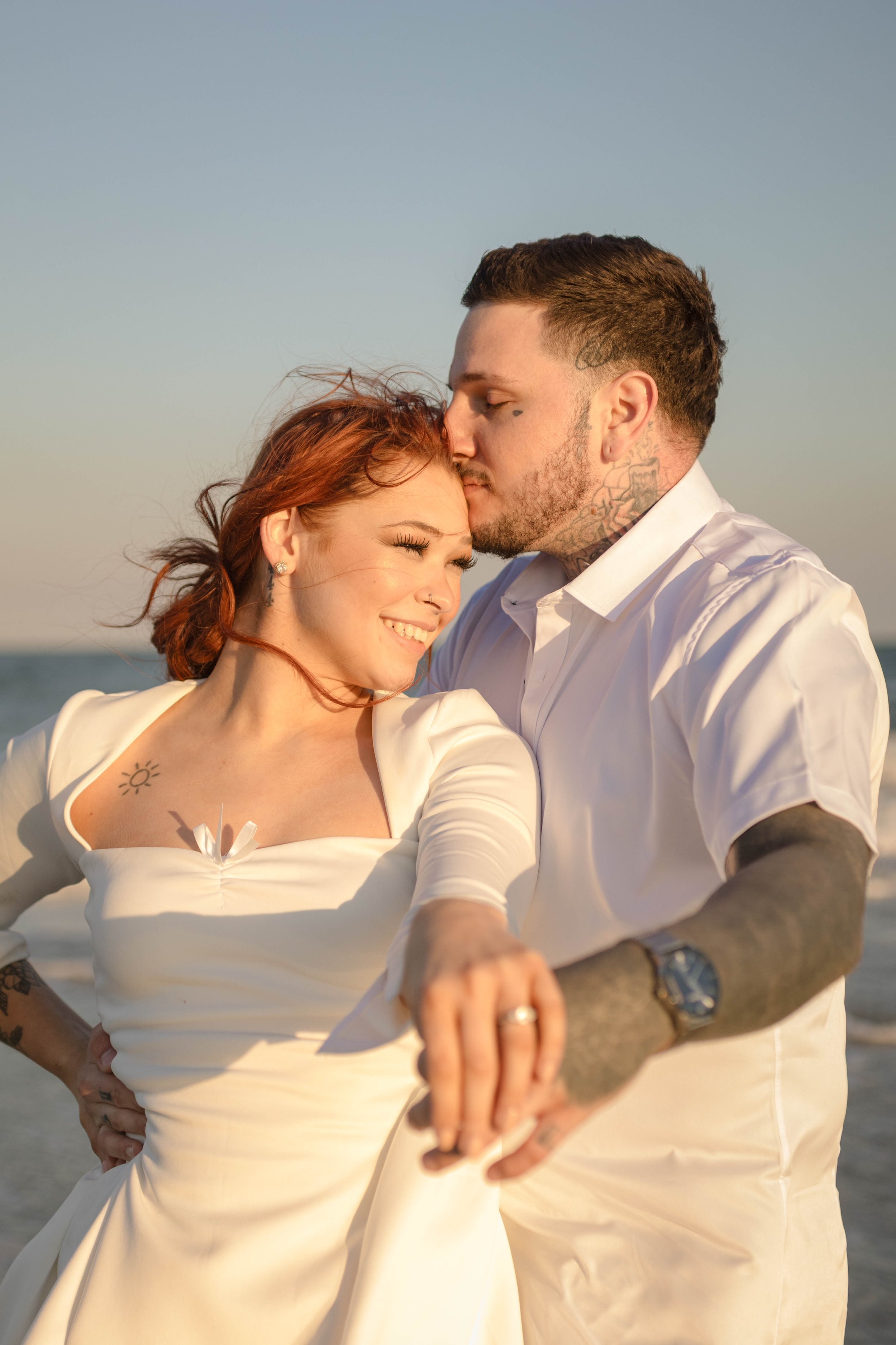 Creative couples portrait in dreamy golden light on Myrtle Beach shoreline