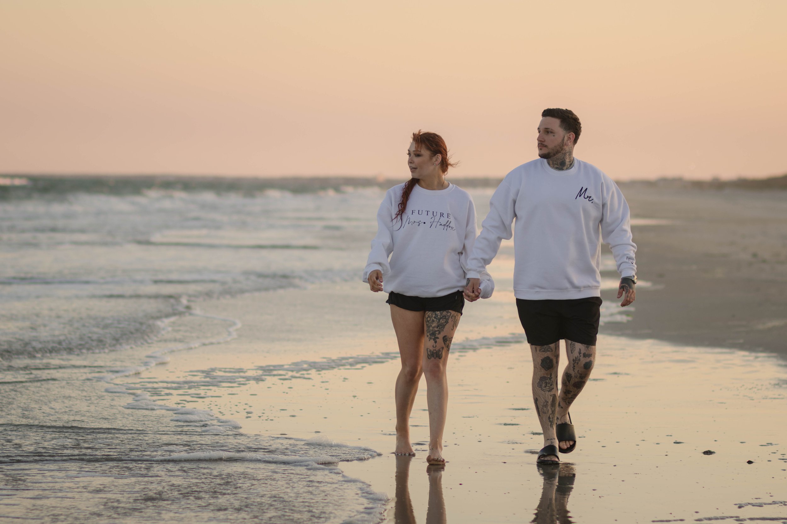 Creative couples portrait in dreamy golden light on Myrtle Beach shoreline