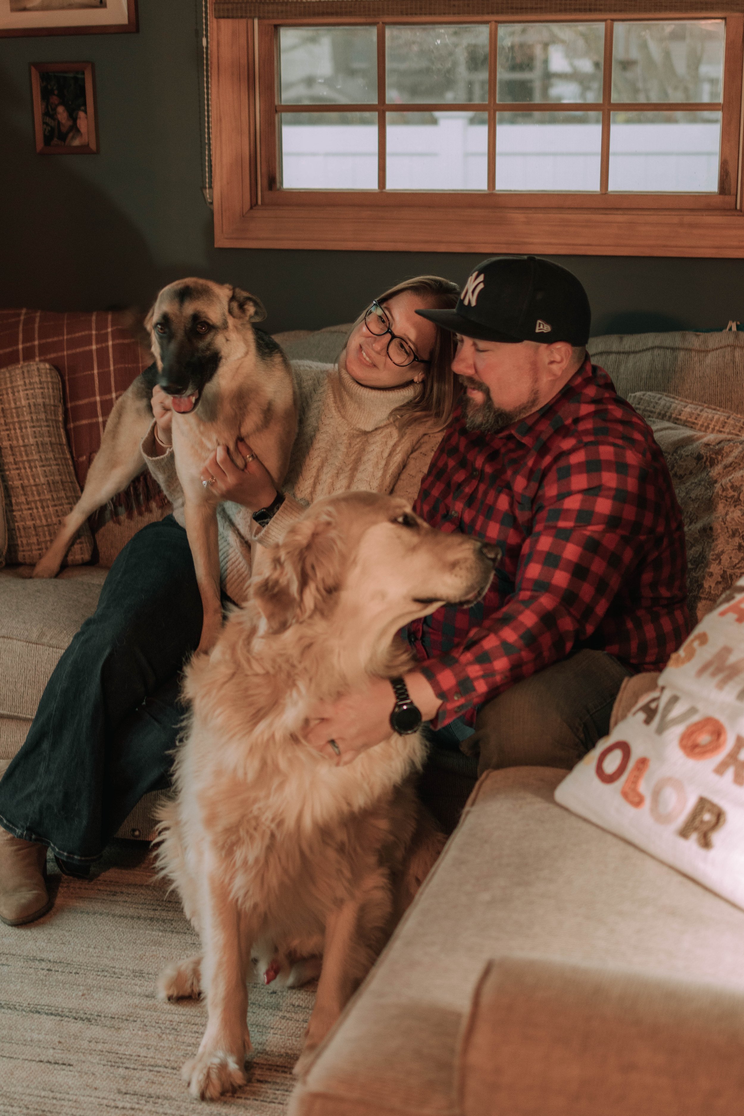 In-Home lifestyle couple photography with German shepherd and golden retriever