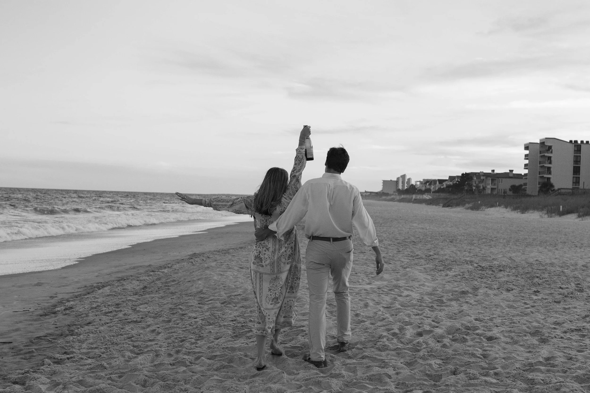 Pawleys Island proposal photography featuring a romantic beach engagement, champagne celebration