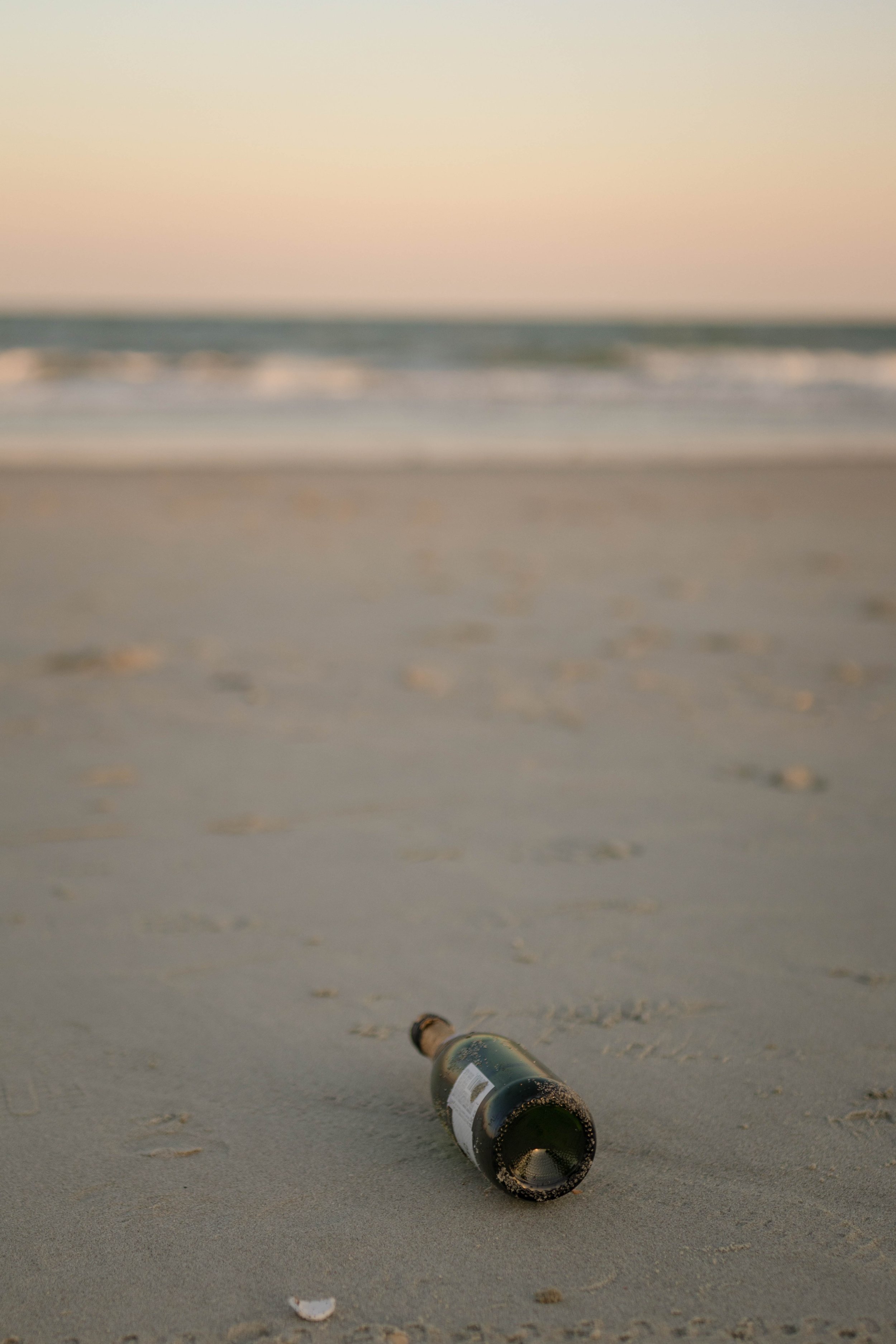 Creative couples portrait in dreamy golden light on Myrtle Beach shoreline
