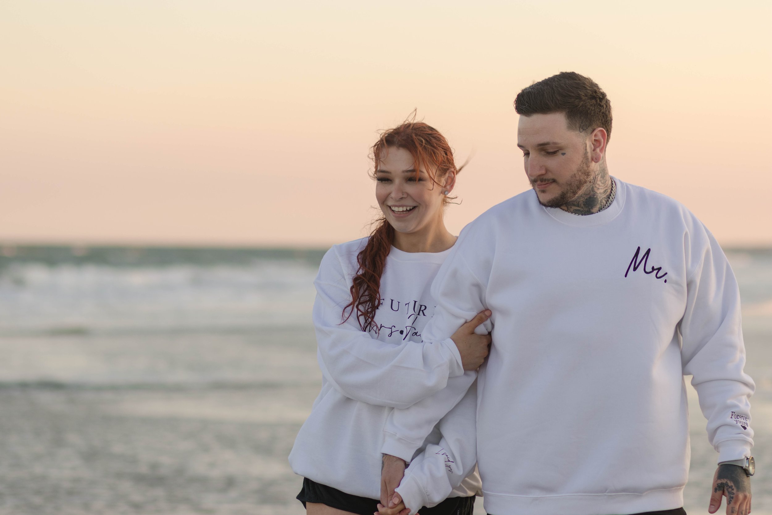 Creative couples portrait in dreamy golden light on Myrtle Beach shoreline