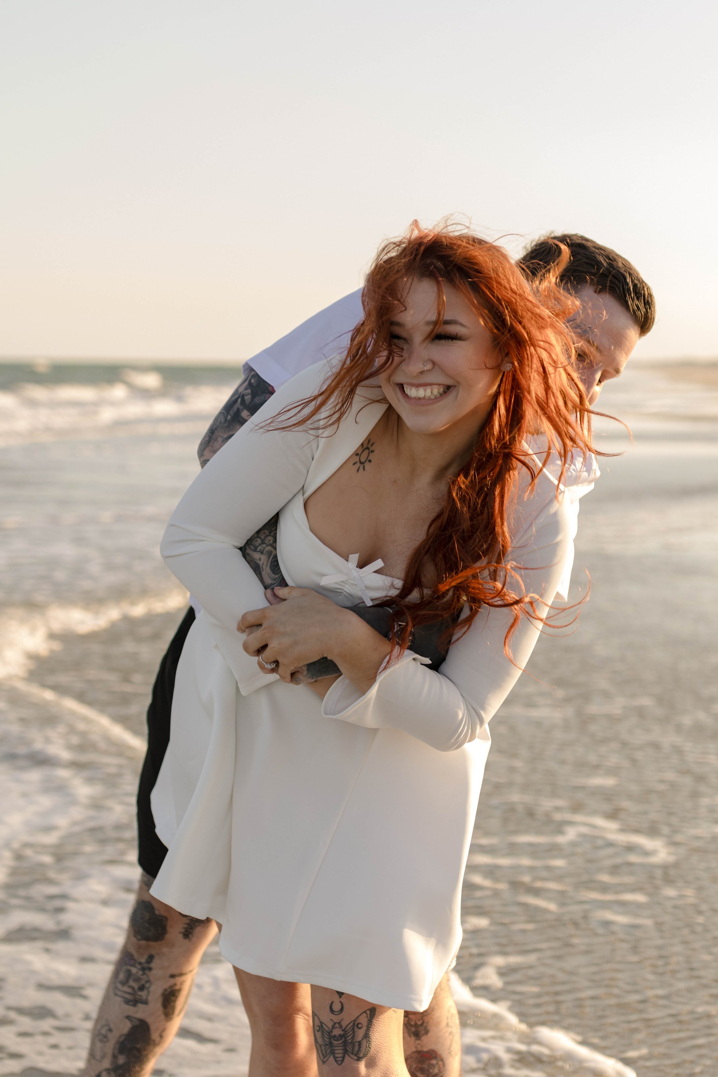 Creative couples portrait in dreamy golden light on Myrtle Beach shoreline