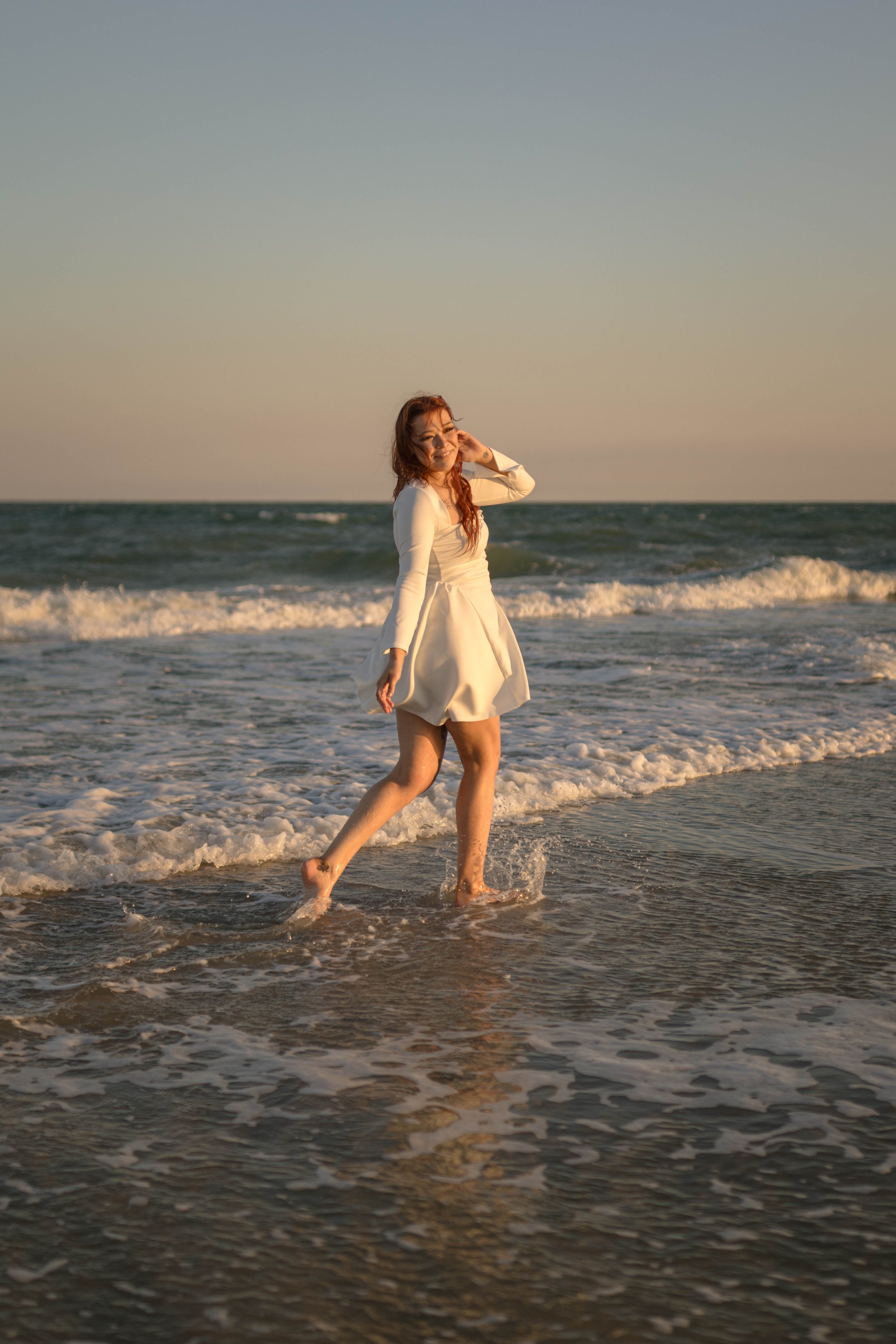 Creative couples portrait in dreamy golden light on Myrtle Beach shoreline
