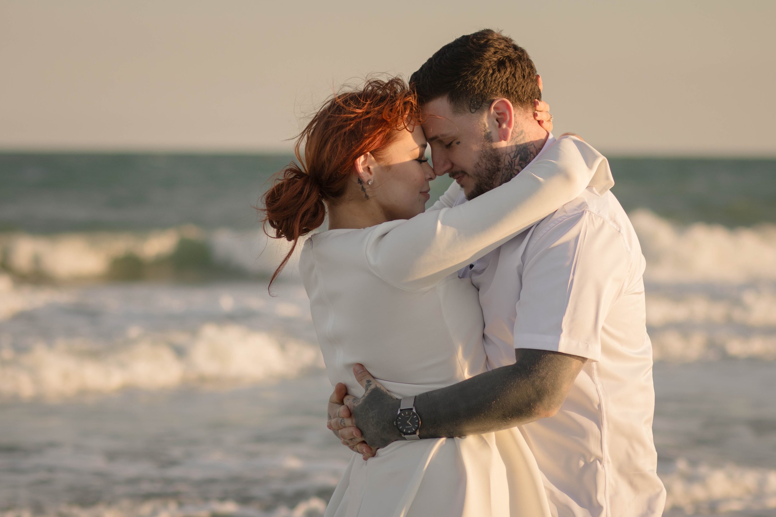 Creative couples portrait in dreamy golden light on Myrtle Beach shoreline
