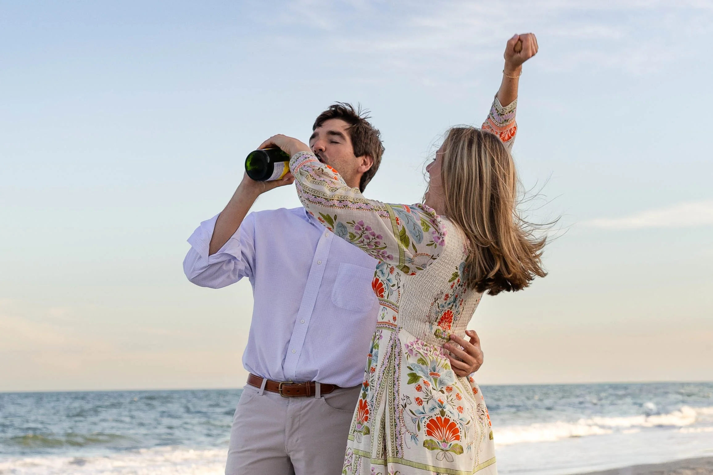 Pawleys Island proposal photography featuring a romantic beach engagement, champagne celebration