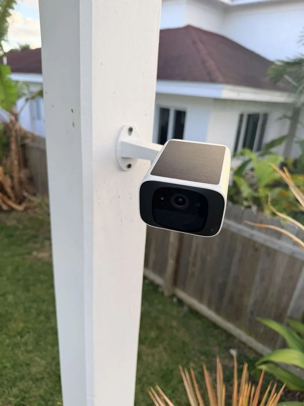 Solar-powered wireless security camera, post-mounted for yard coverage