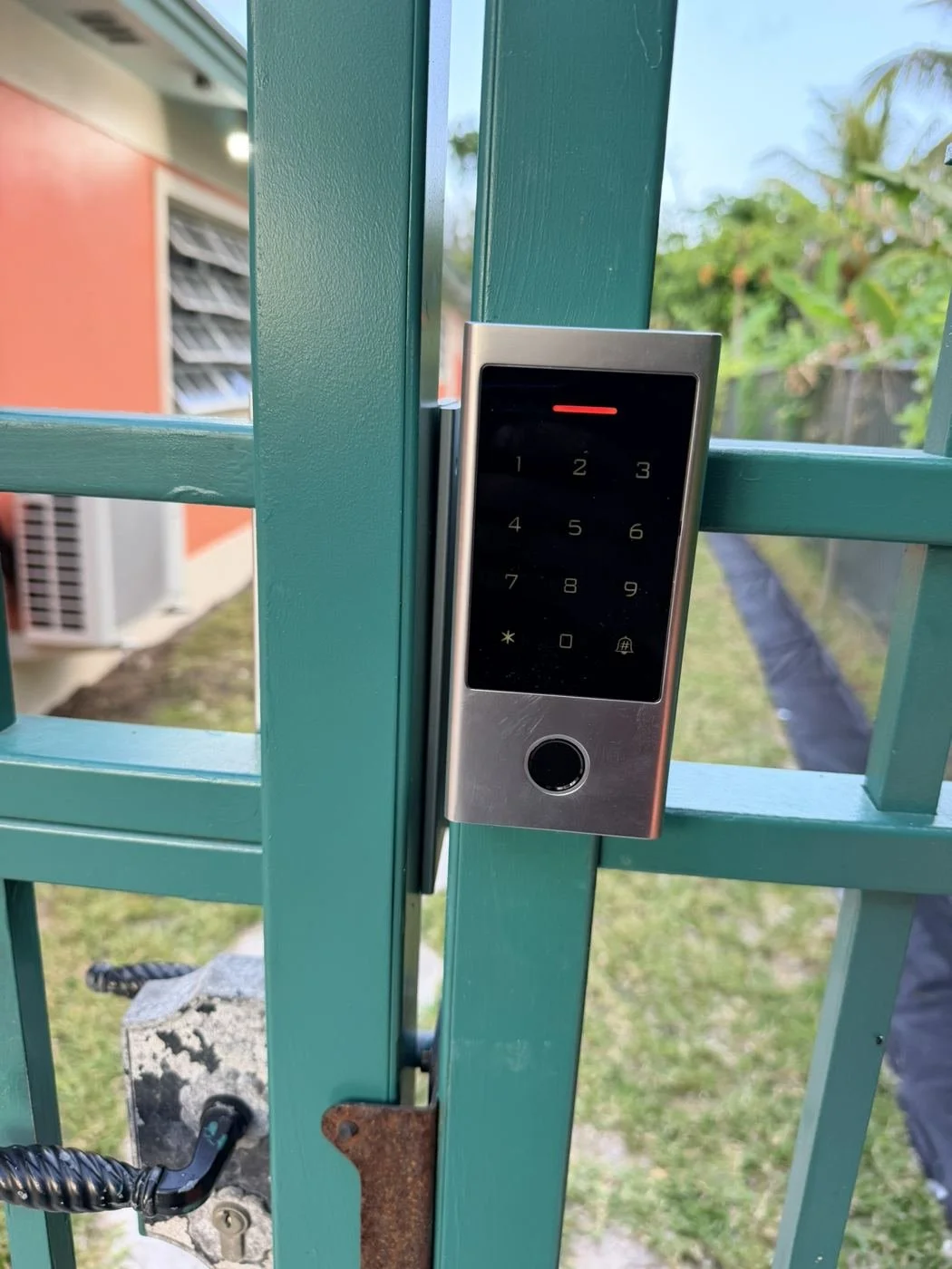 Keypad and fingerprint access control reader on a security gate