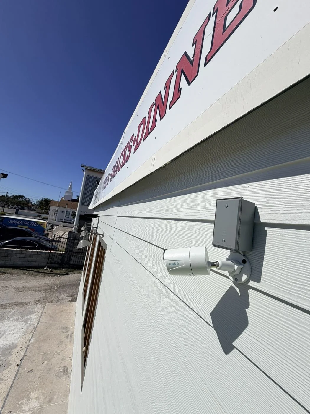 Bullet camera with weatherproof box, restaurant exterior install