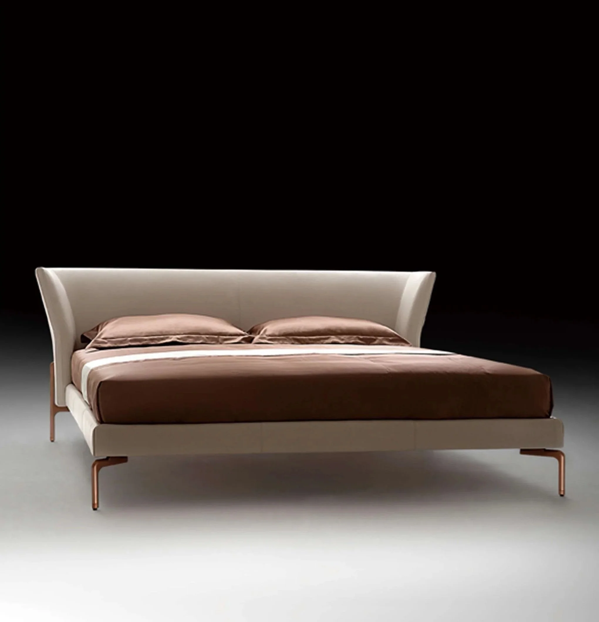 Collectible design bed with tall curved headboard and warm neutral tones.