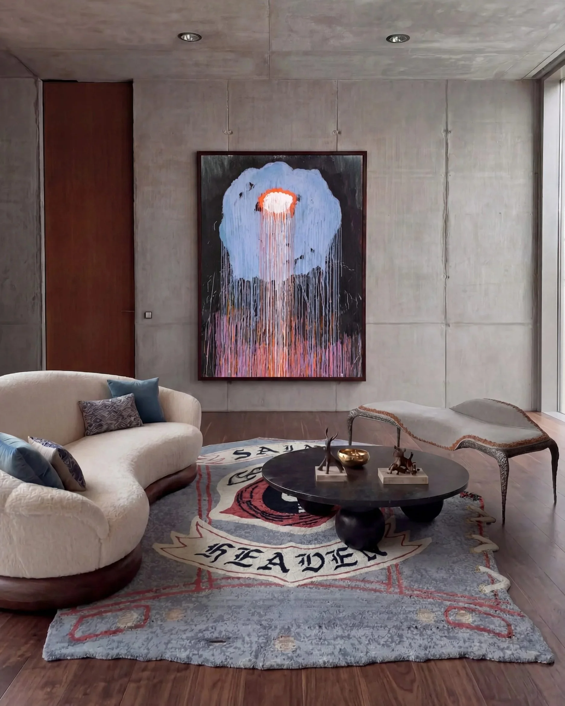 saints-julien-jaca-hand-knotted-rug-concrete-interior.jpg