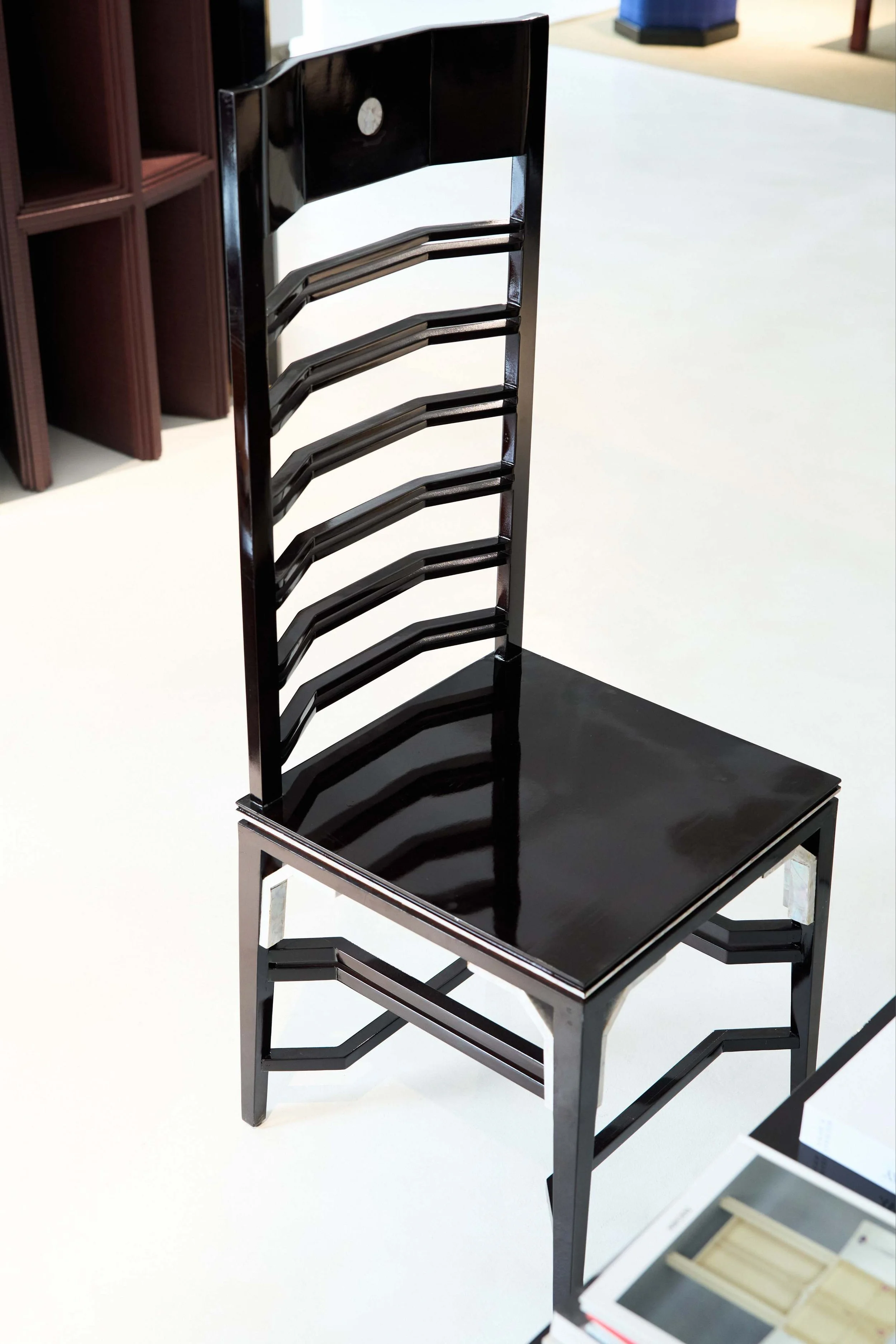 Collectible Asian design chair by ARTEMPO with kaiguang openwork details.
