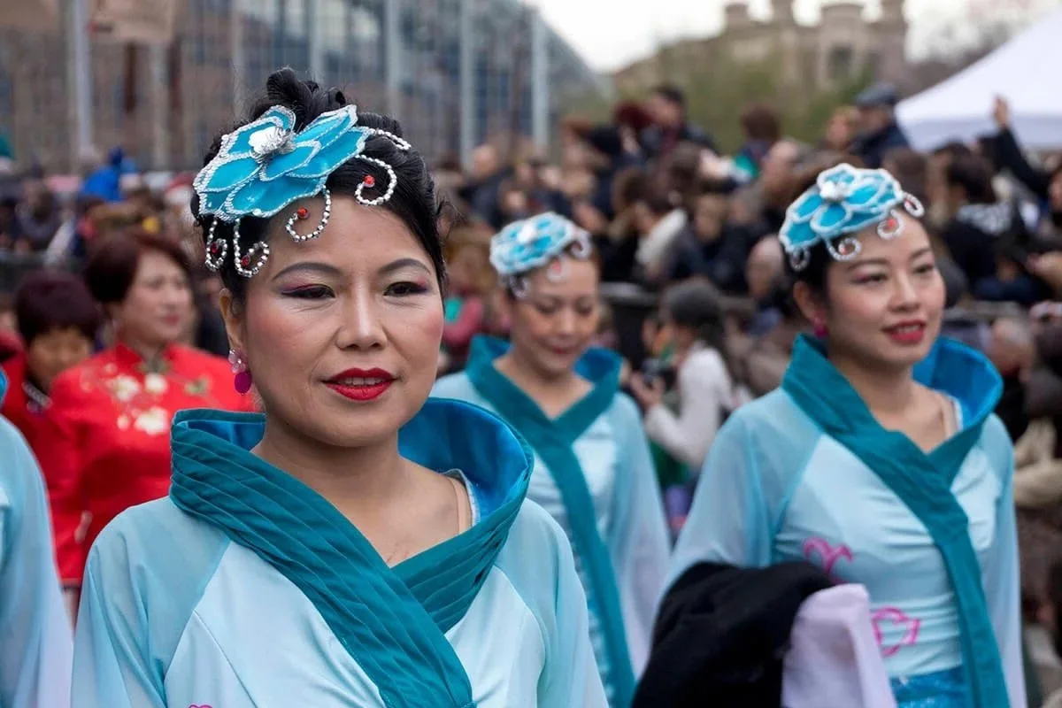 Families celebrating Lunar New Year 2026 with festive customs