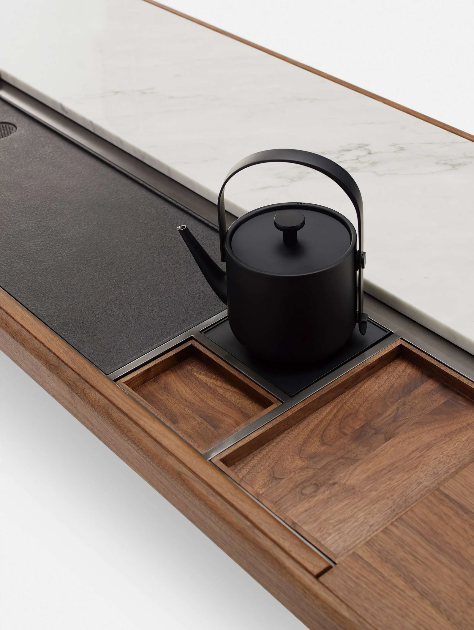 Luxury contemporary tea table featuring built-in drainage and kettle zone.
