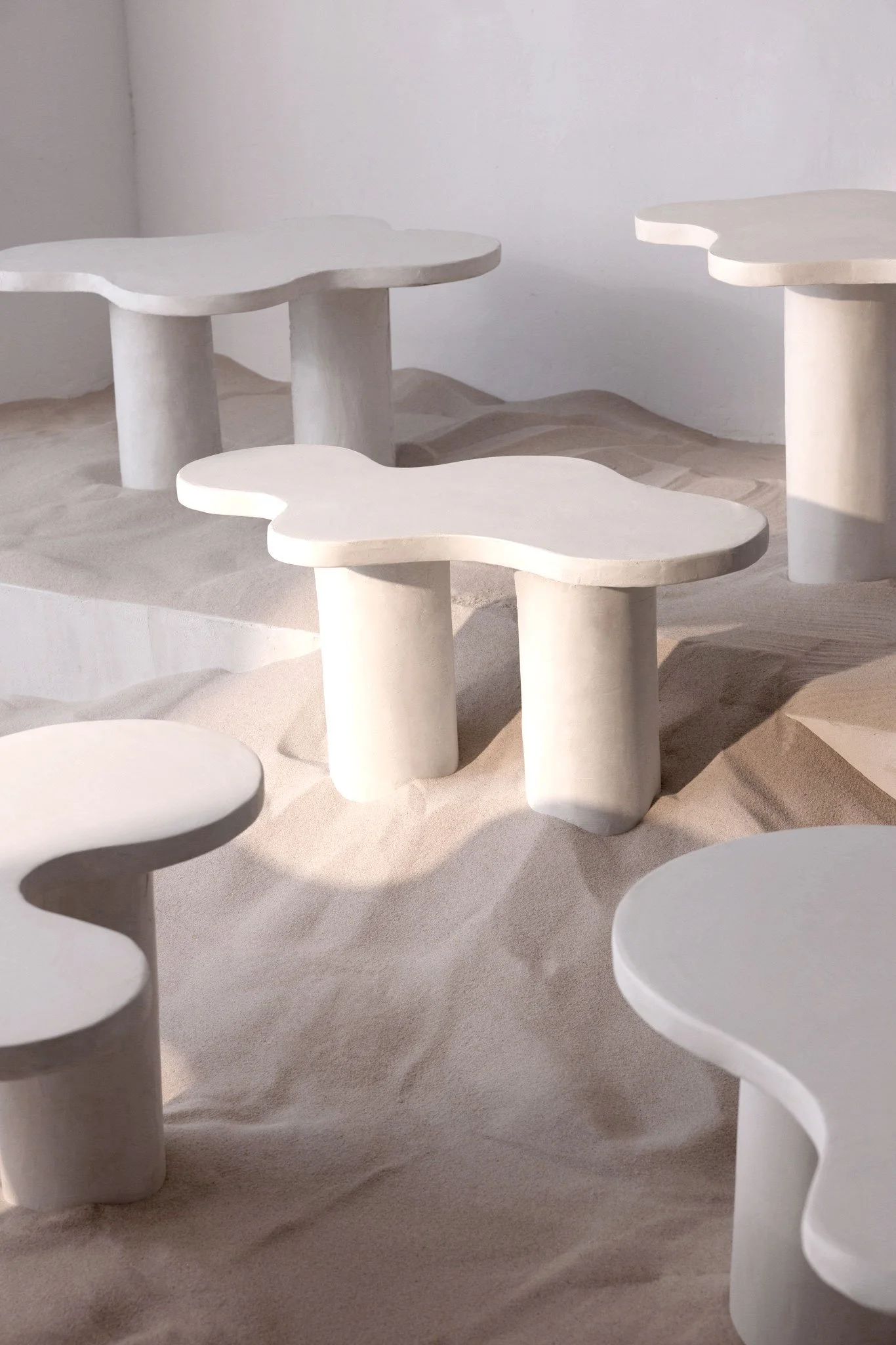 Handmade sculptural furniture with soft architectural lines designed for modern residential spaces