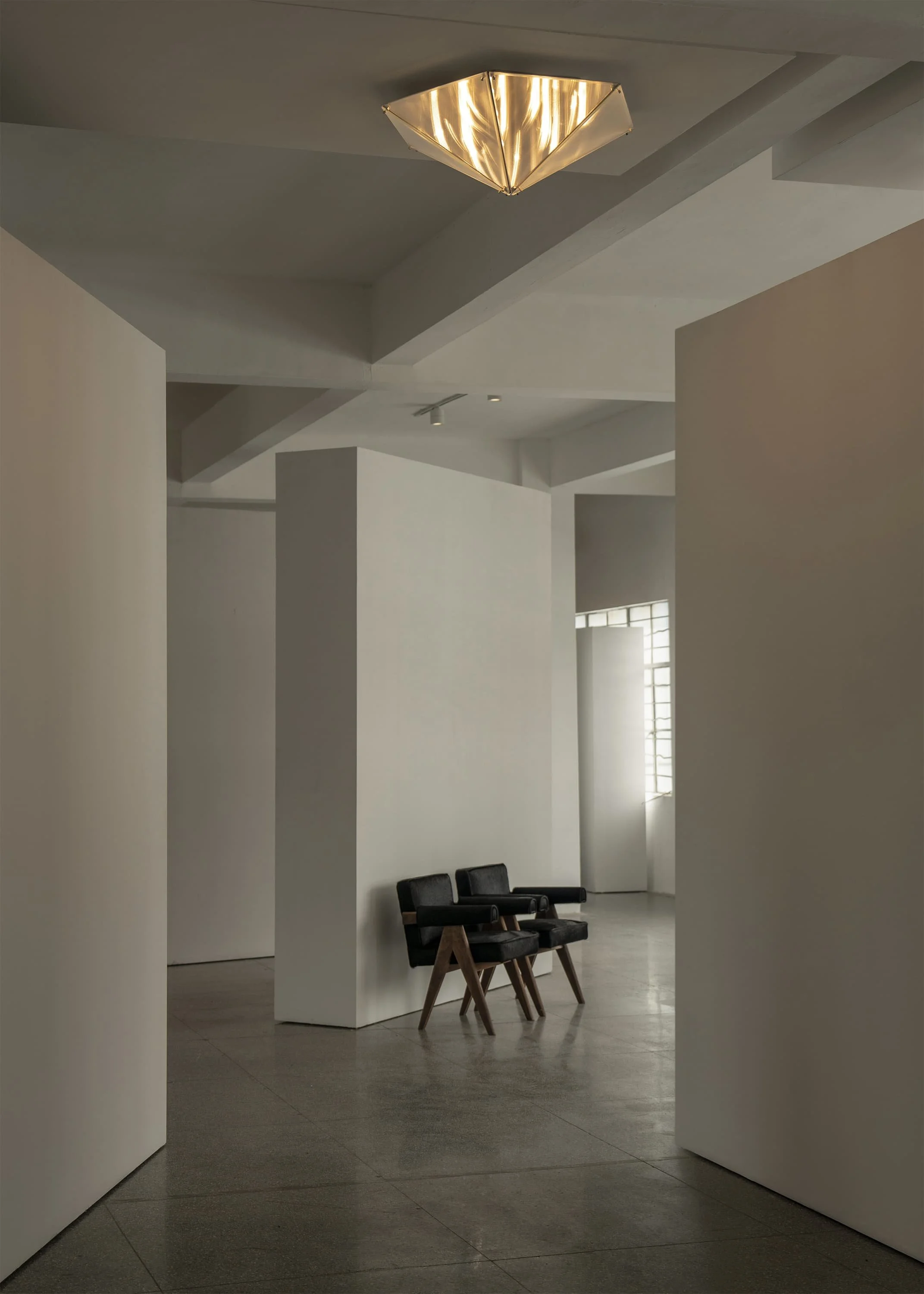 Modern ceiling lamp producing soft wave-like light reflections, Fragment 07.