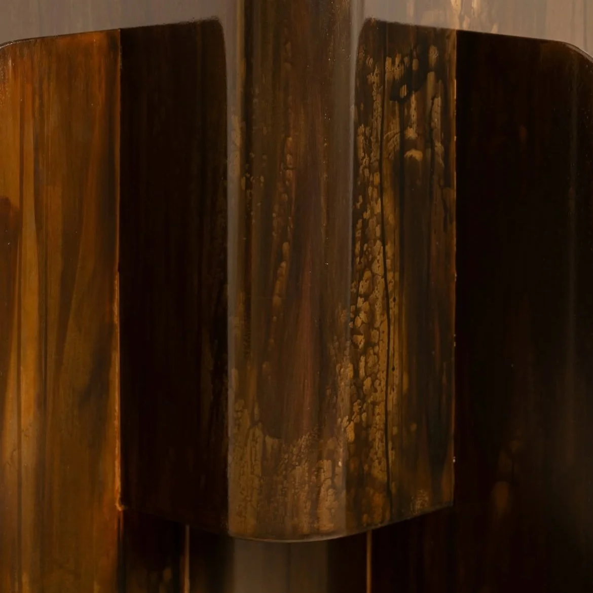 Luxury contemporary floor lamp with layered metal structure and atmospheric glow, designed by Maxime Halot.