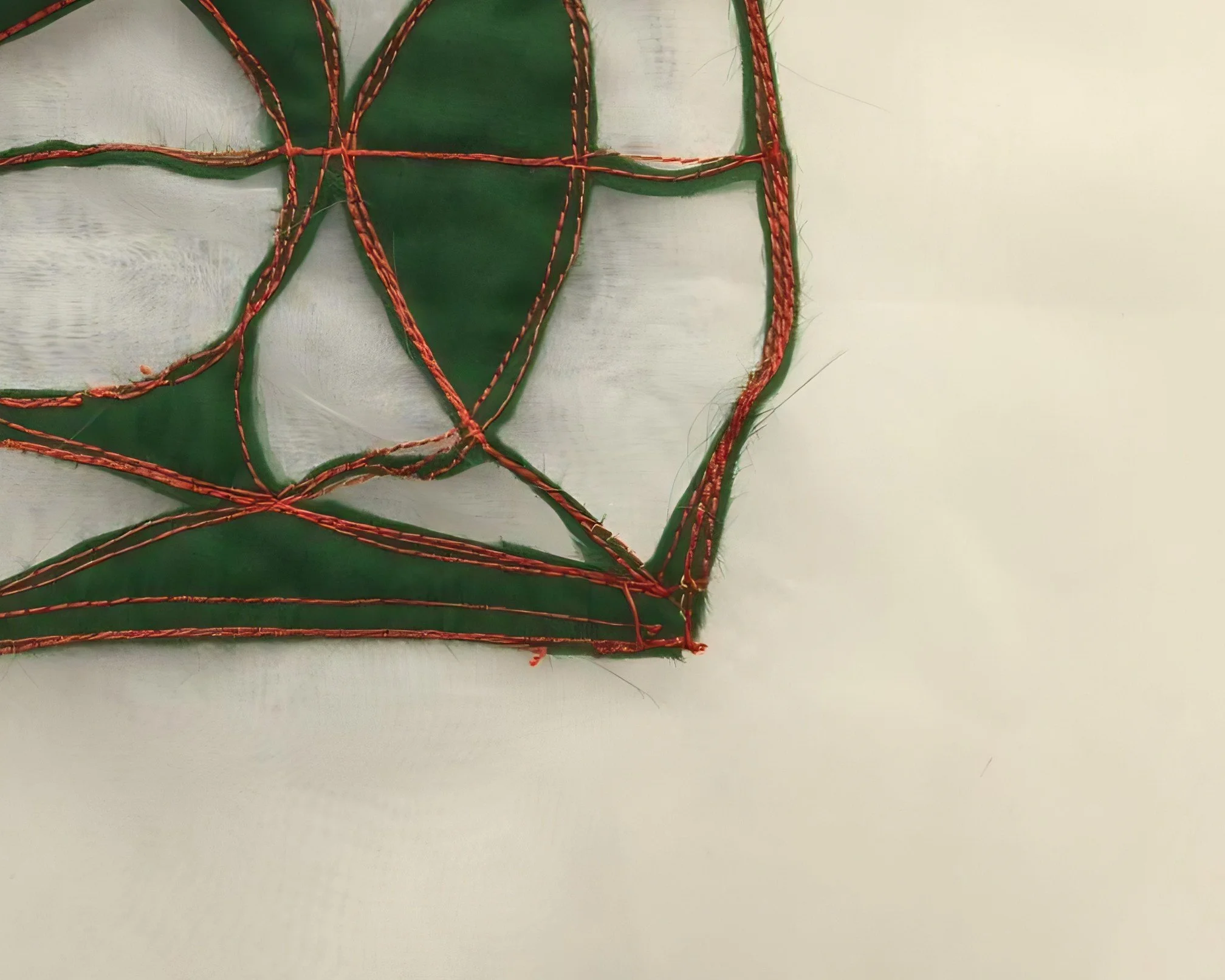 Abstract fiber art composition with stitched geometric patterns displayed in a Barcelona contemporary art gallery