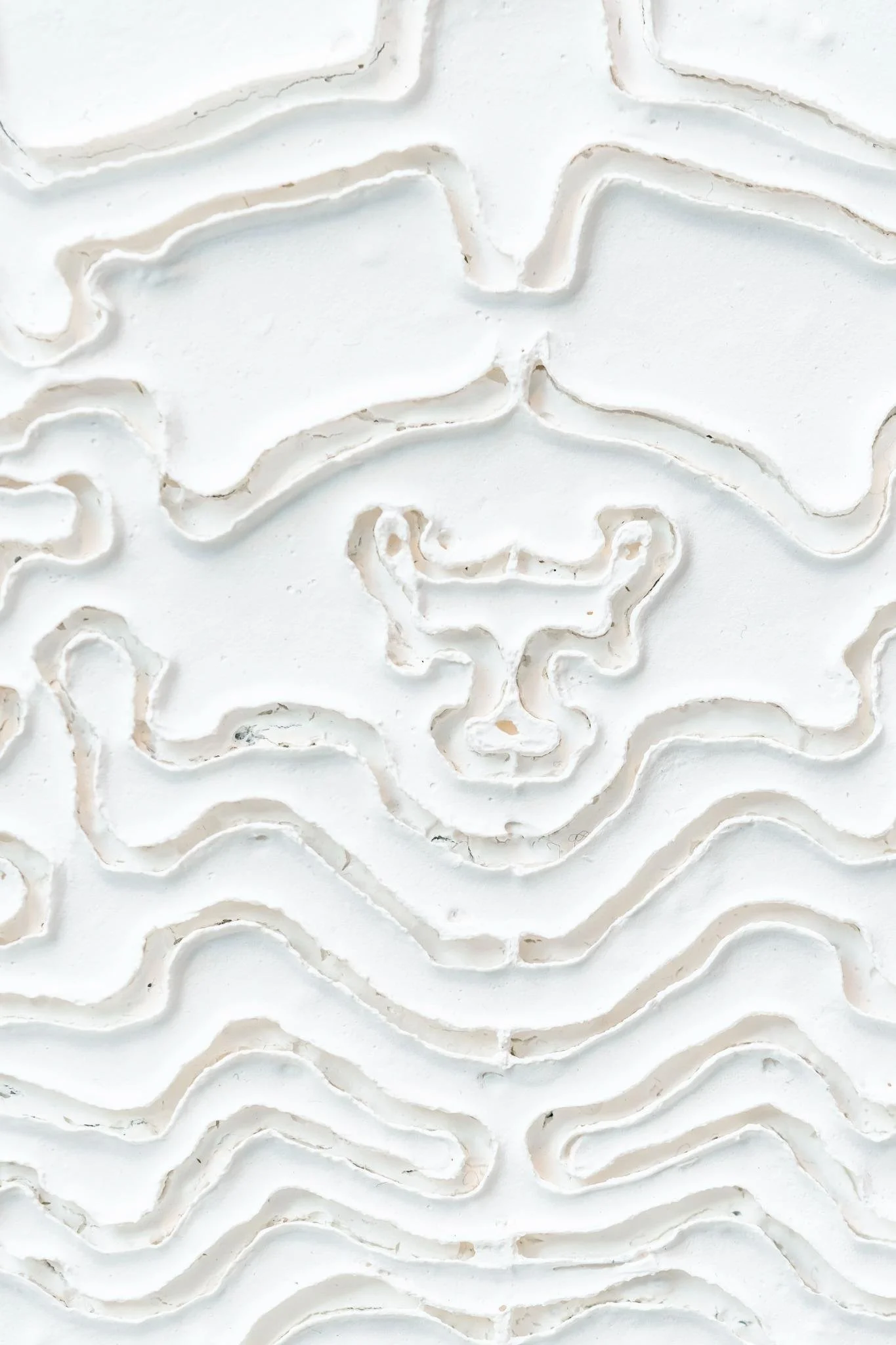 Sculptural wall artwork by Robert Pous with layered organic forms and minimalist monochrome composition.