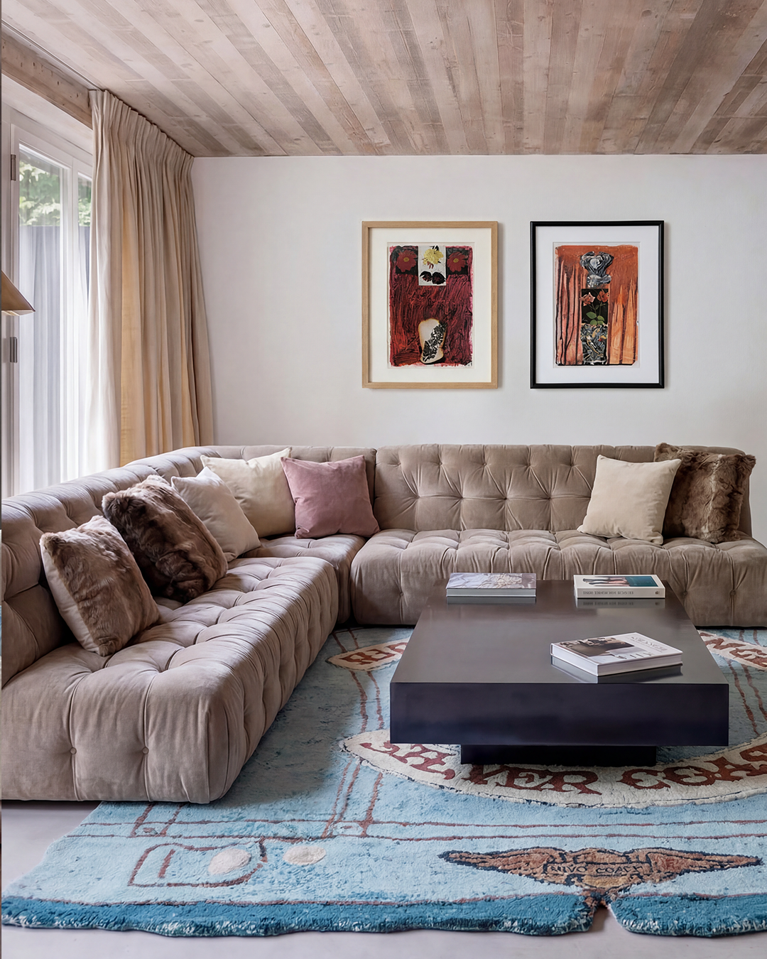 Riders of Silence limited edition art rug by Julien Jaca in a bright living room with a tufted velvet sofa and framed artworks