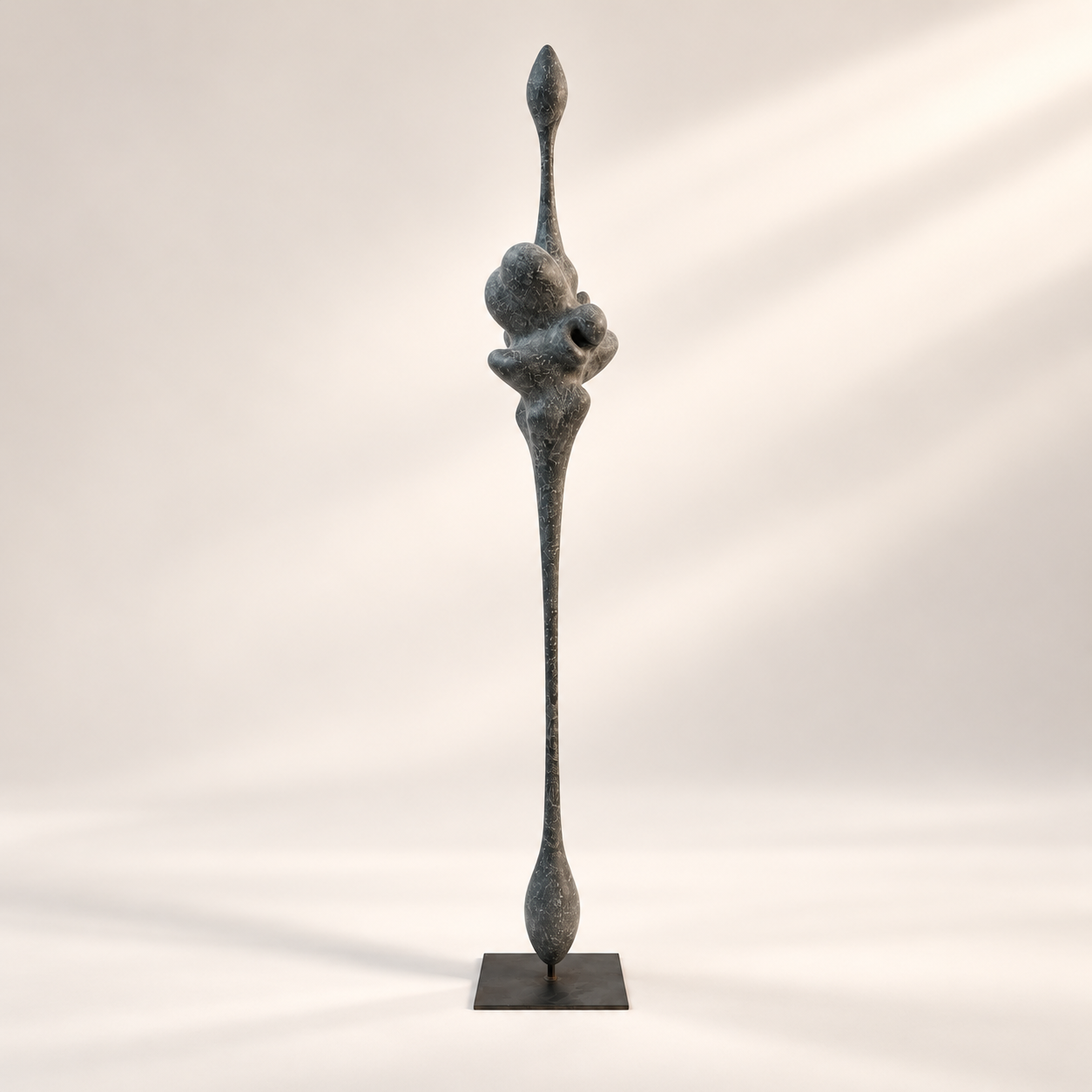 Slender dark grey recycled paper sculpture with bulbous forms by Justino Del Casar for BLANCONEGRO Barcelona Art gallery