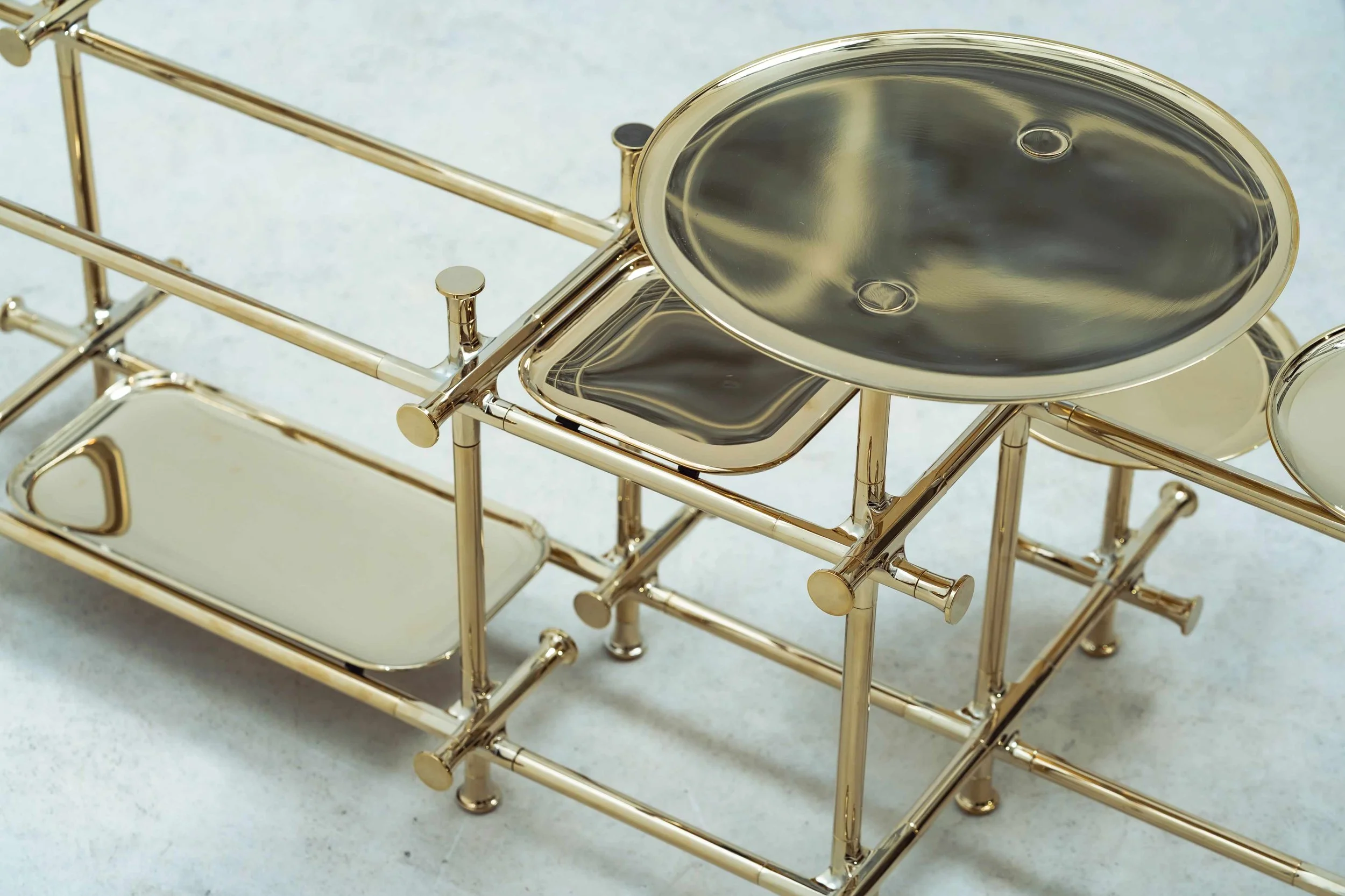 Chen Darui polished brass furniture artwork with modular grid and reflective surfaces.