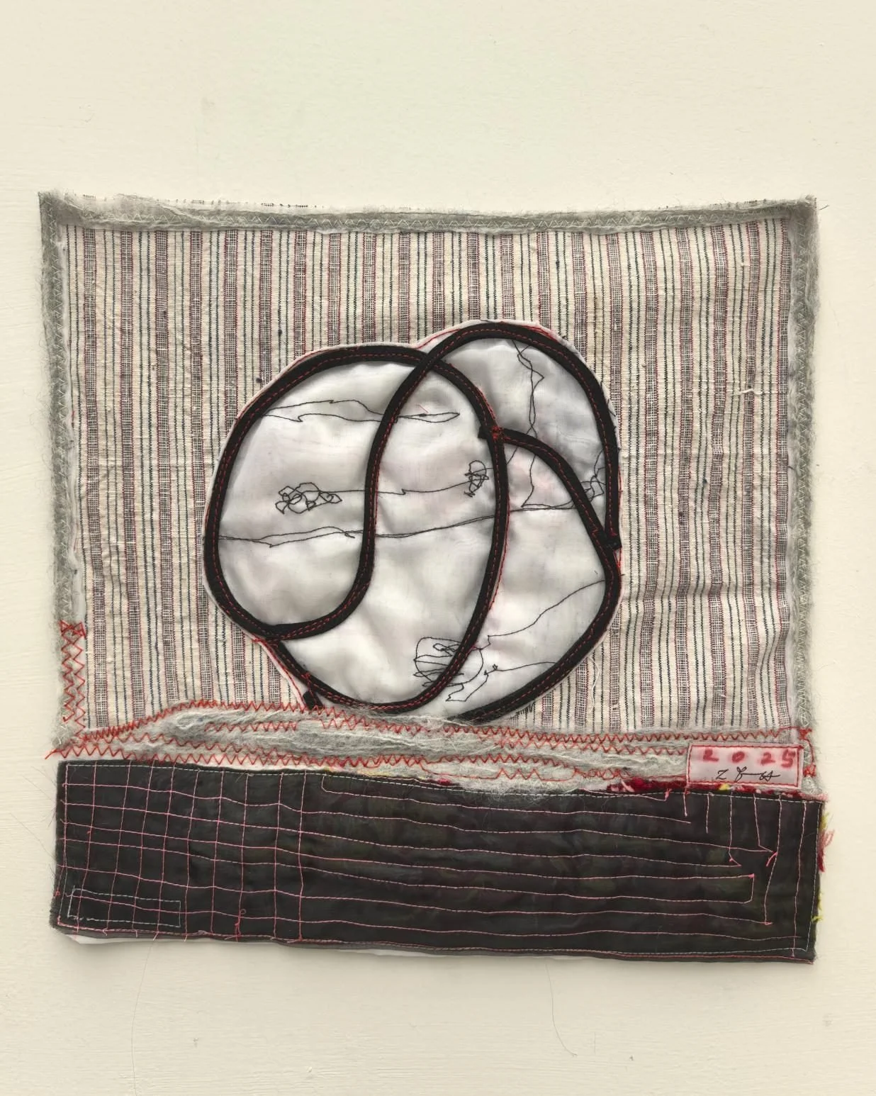 Contemporary fiber art with expressive stitching and fabric layering