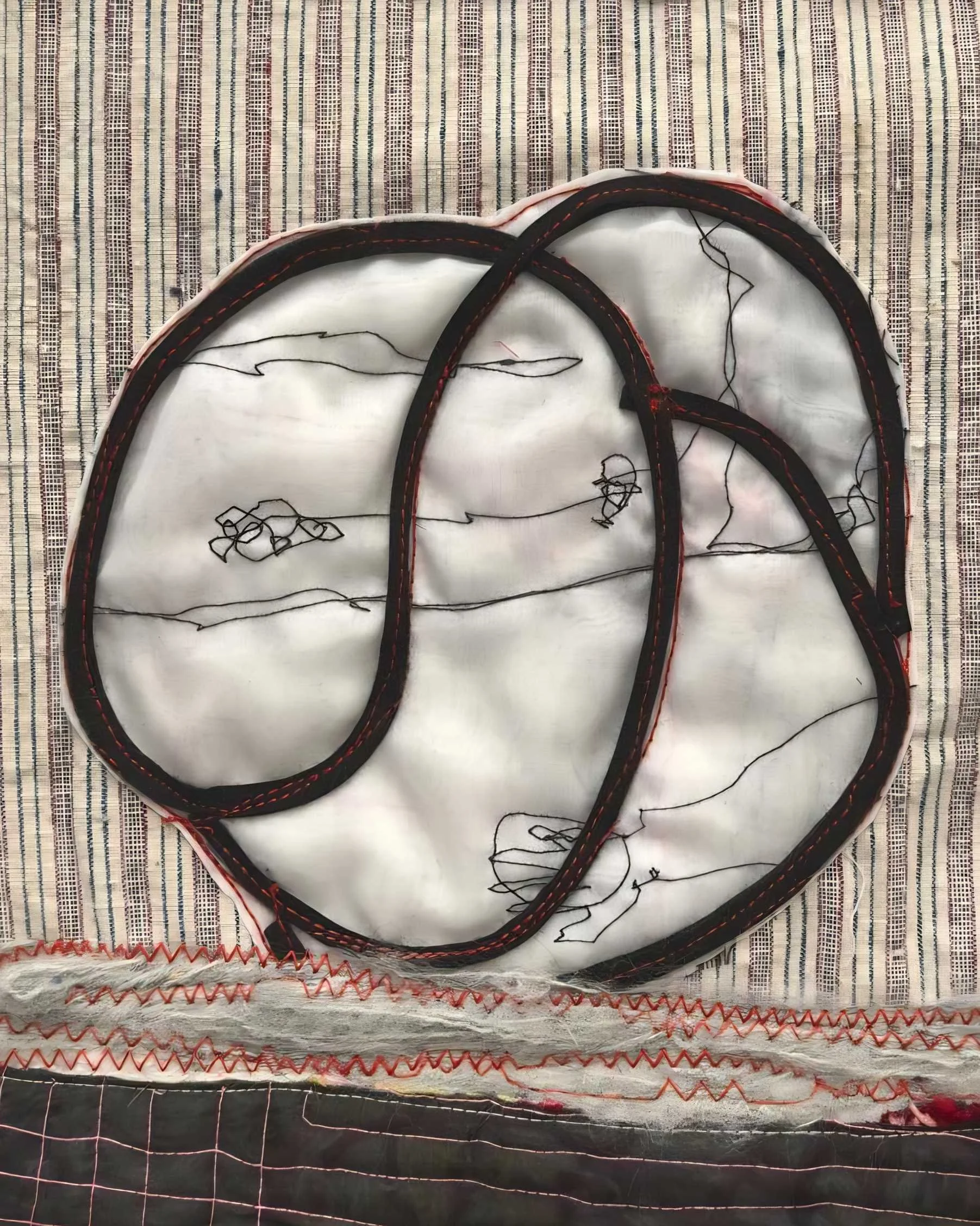 Unique contemporary textile piece with layered fabrics and embroidered lines
