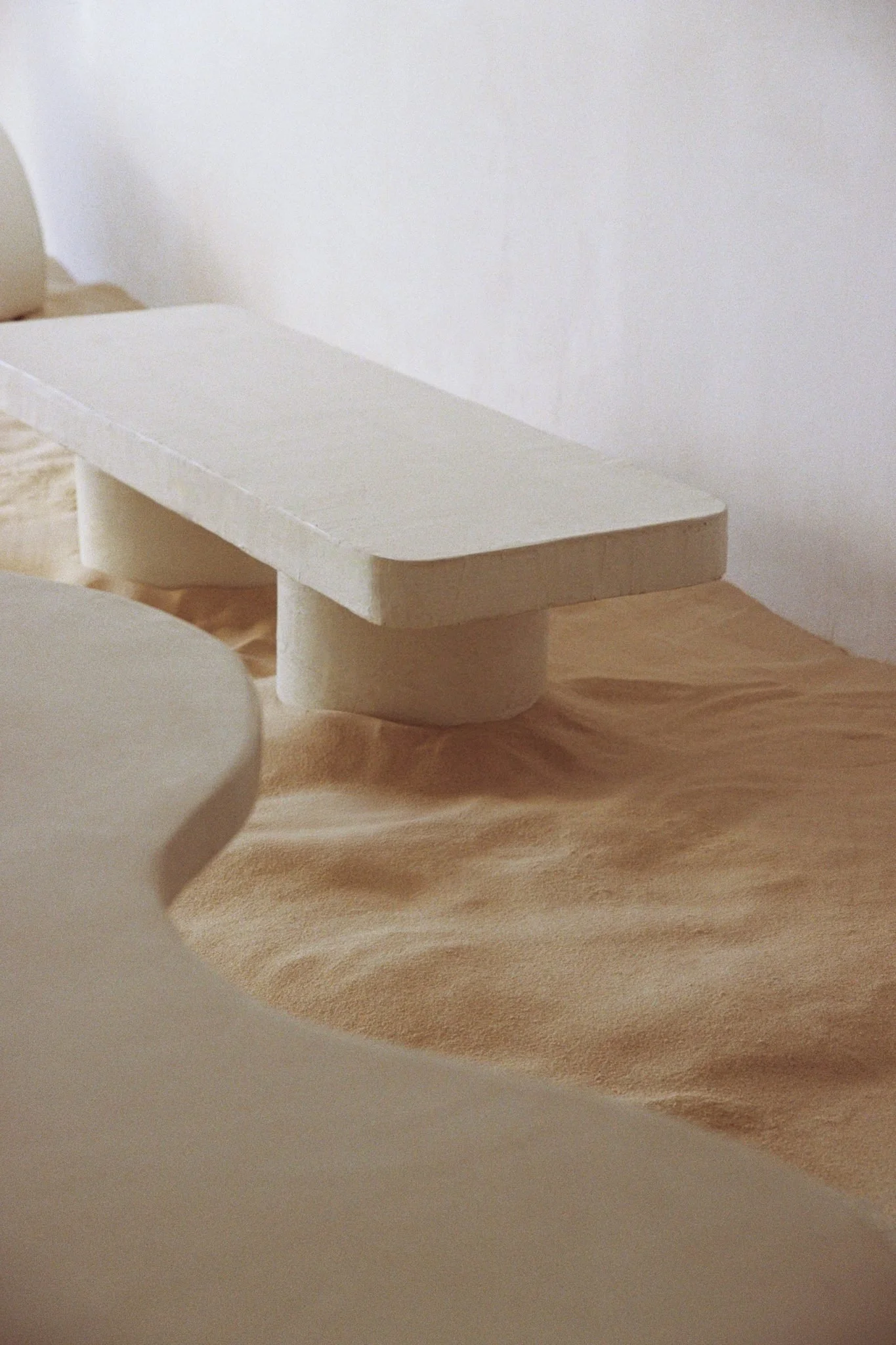 Contemporary sculptural coffee table handmade in microcement ITS A MOOD