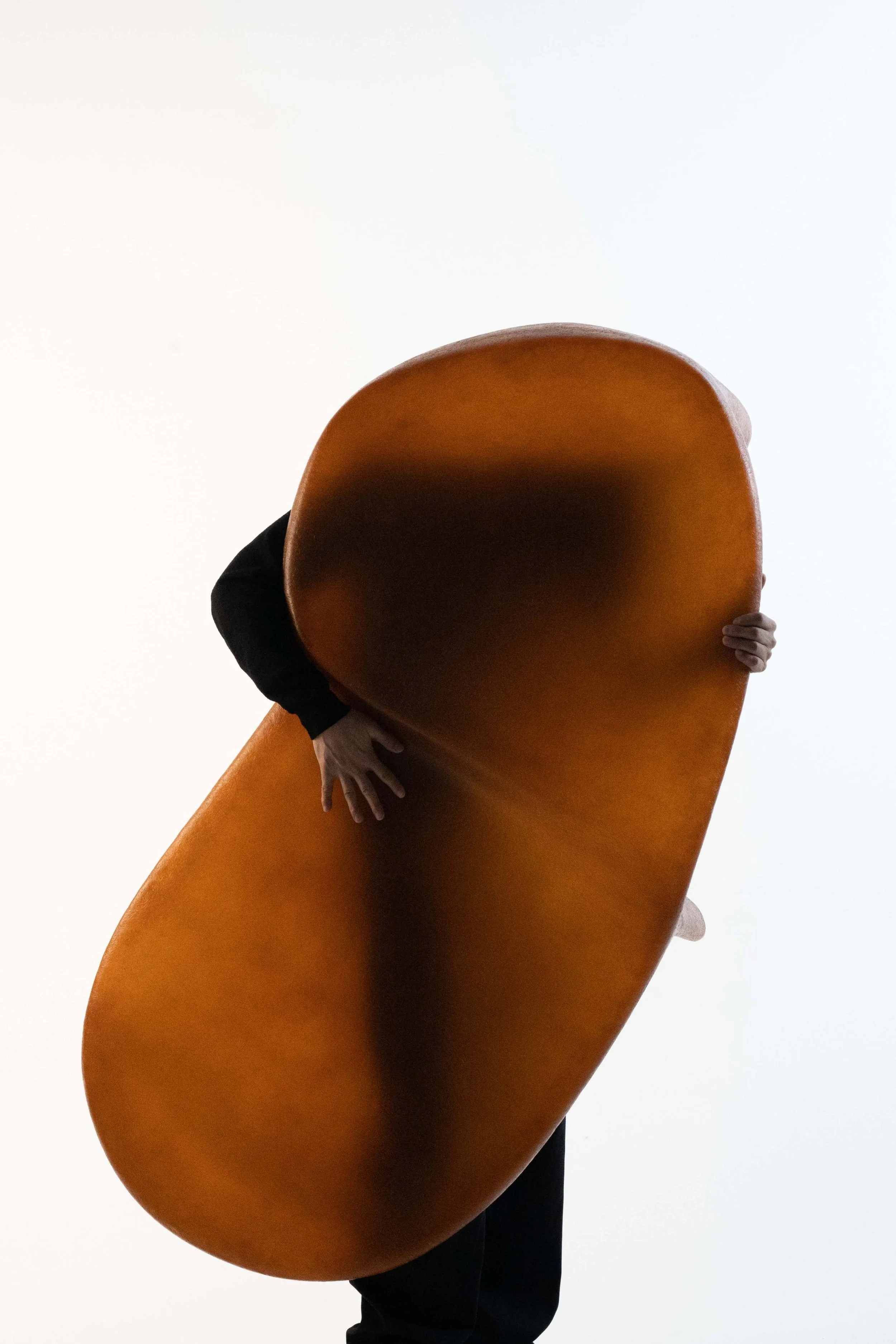 Art furniture tea table by Carlos Chen featuring smooth flowing contours