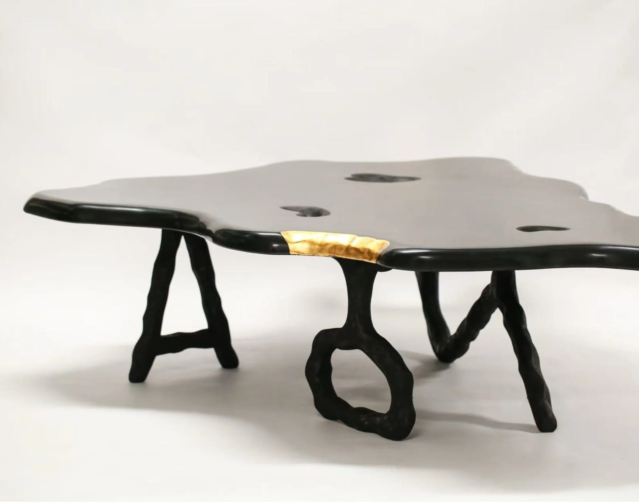 Jiaying Xu 2025 sculptural lacquer table with gold leaf accents